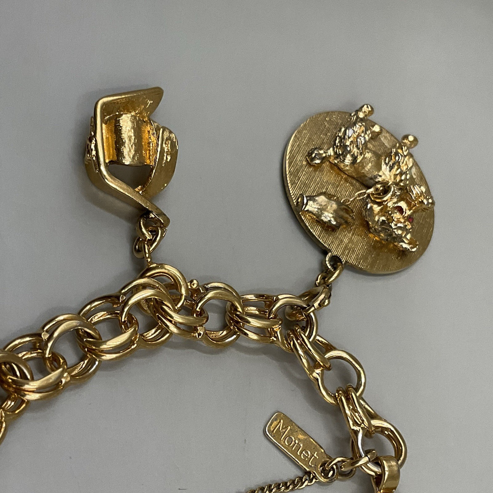 Monet Women’s 7 Charm Bracelet Gold Tone Travel Birthday Puppy Travel Communion