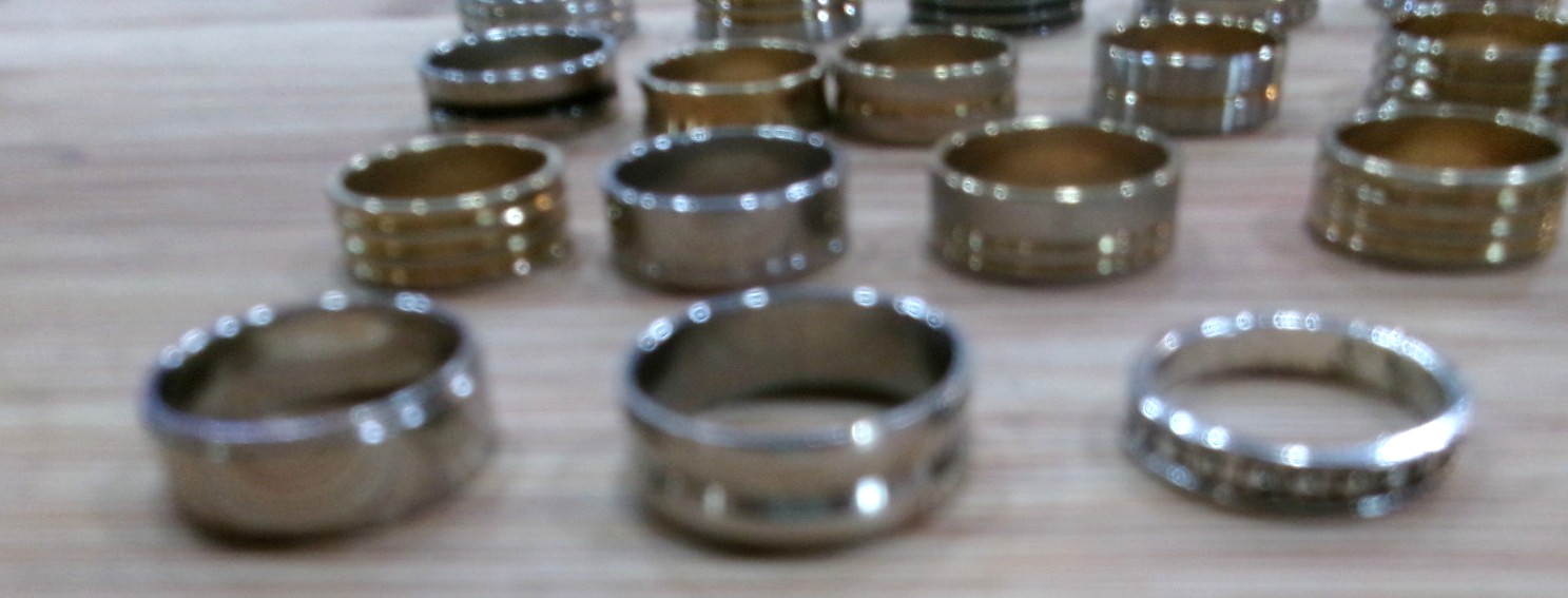 Lot of 24 Band Style Rings-Goldtone/Silvertone/Black Sizes 7-11