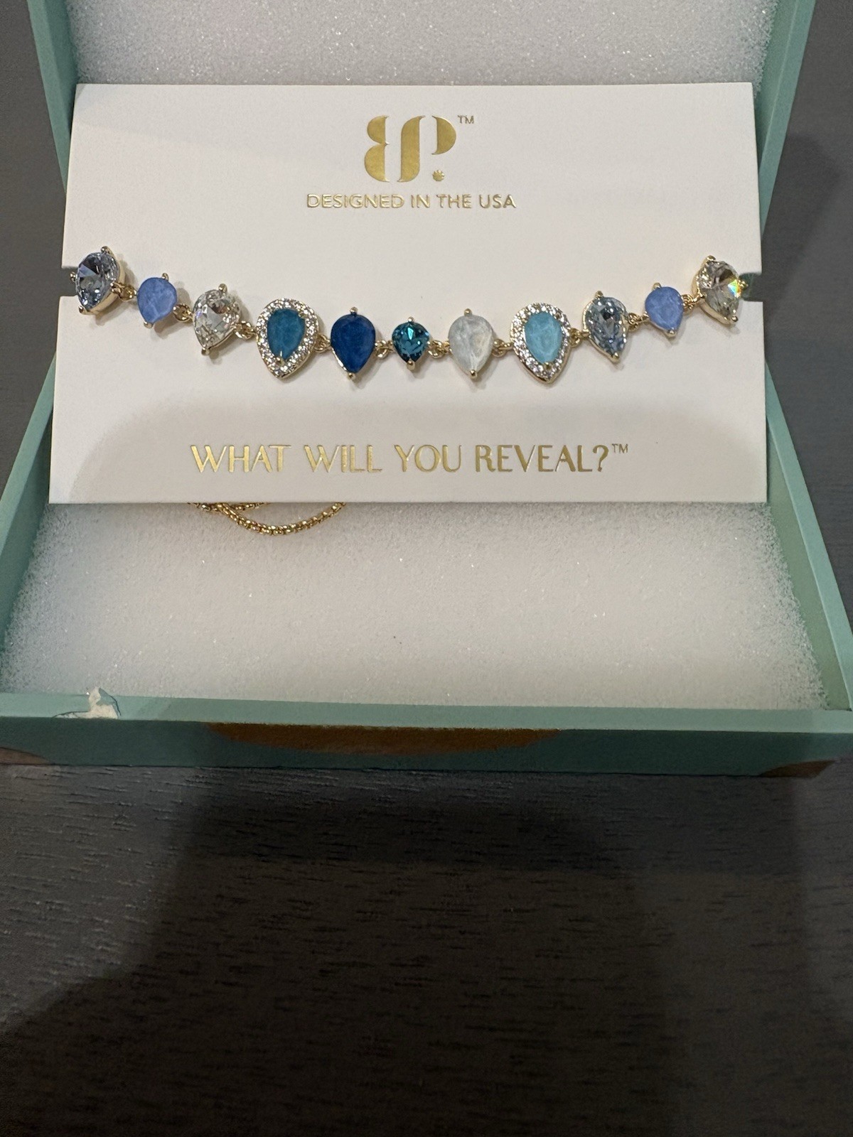 Passport Stamped BR90480 Gold Plated Adjustable Bracelet, Blue Teardrop