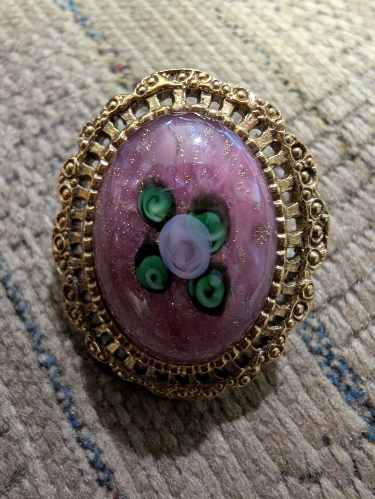 Gold Colored Filigree Earrings With Flower And Leaves Surrounded By Purple