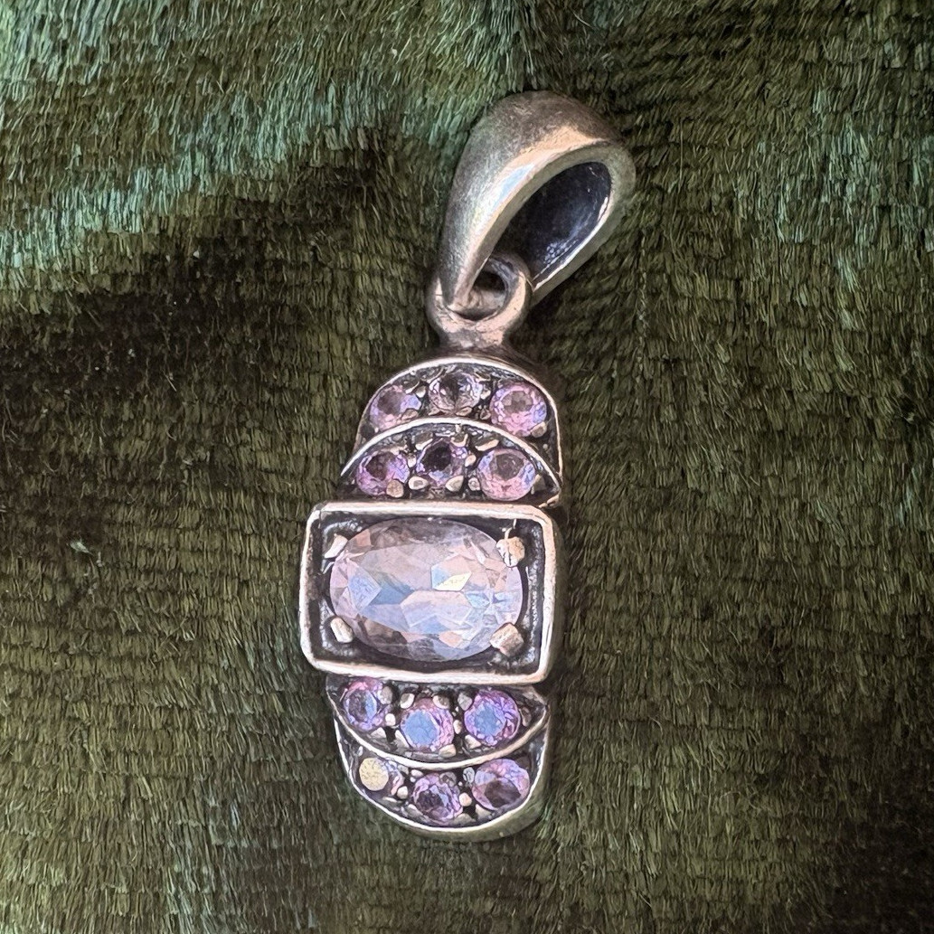 Beautiful 925 sterling silver pendant with a natural oval-cut amethyst & accents