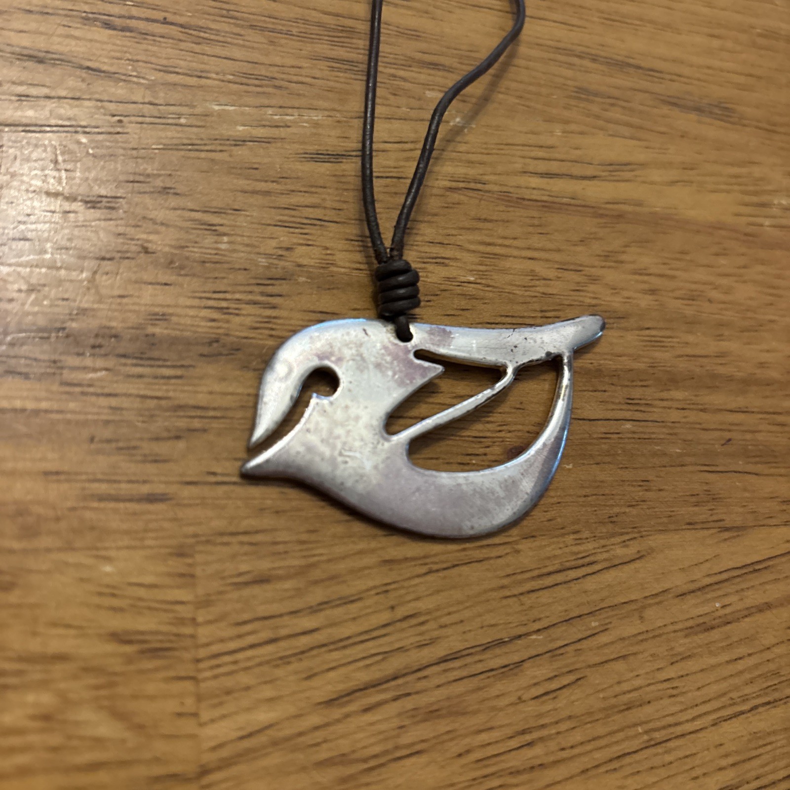 Fossil Silver Bird on brown leather cord – 16” Necklace w/ 2” extender