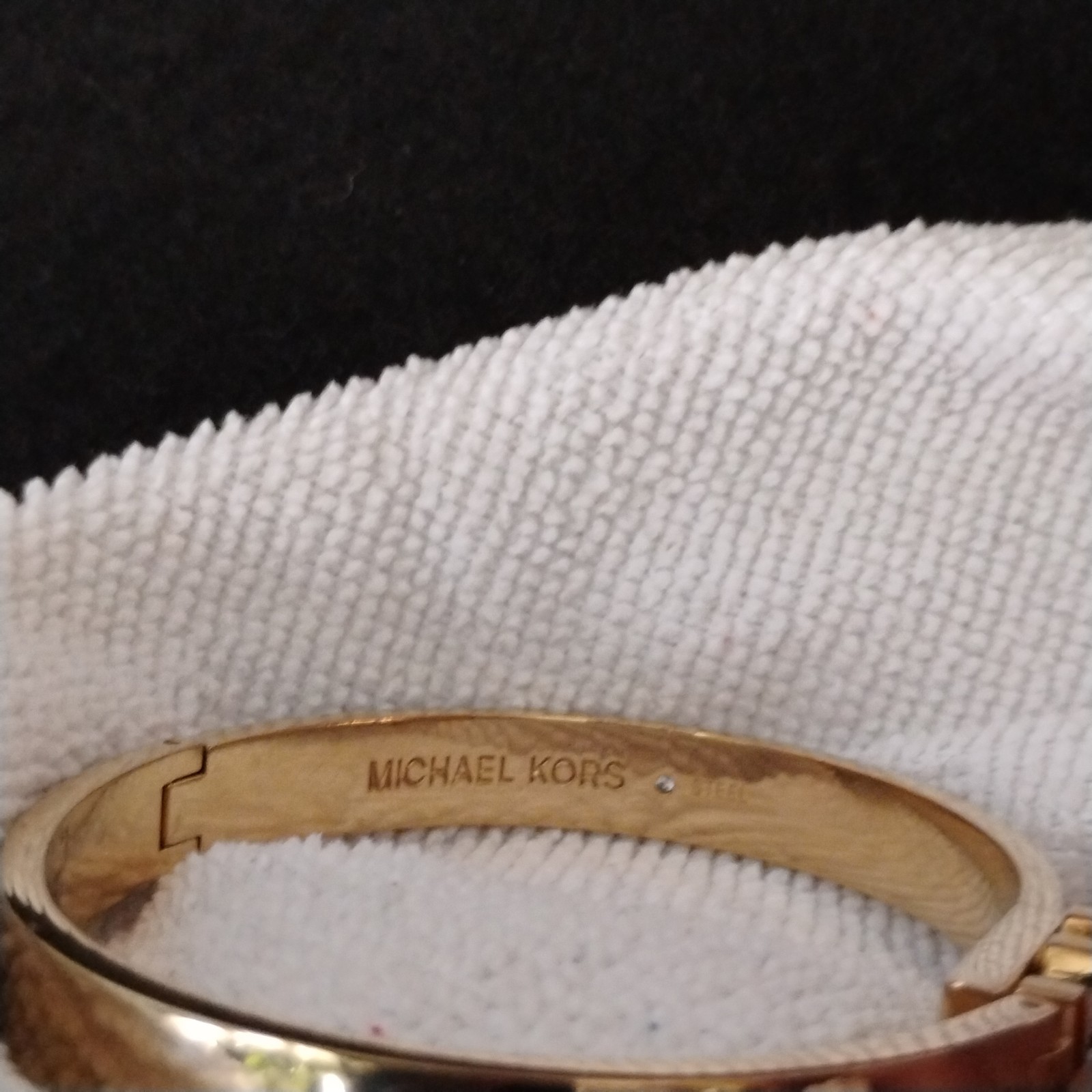 Michael Kors Gold Tone Hamilton Bangle Bracelet with Jeweled Swing Clasp