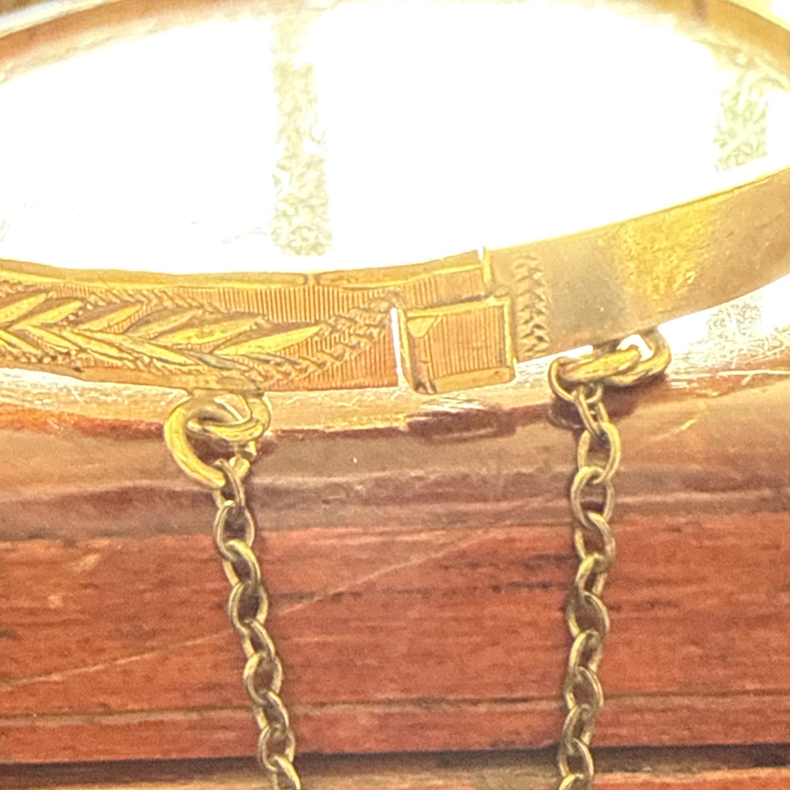 B Ltd 9ct 50 Micron Rolled Gold hinged engraved bangle with safety chain