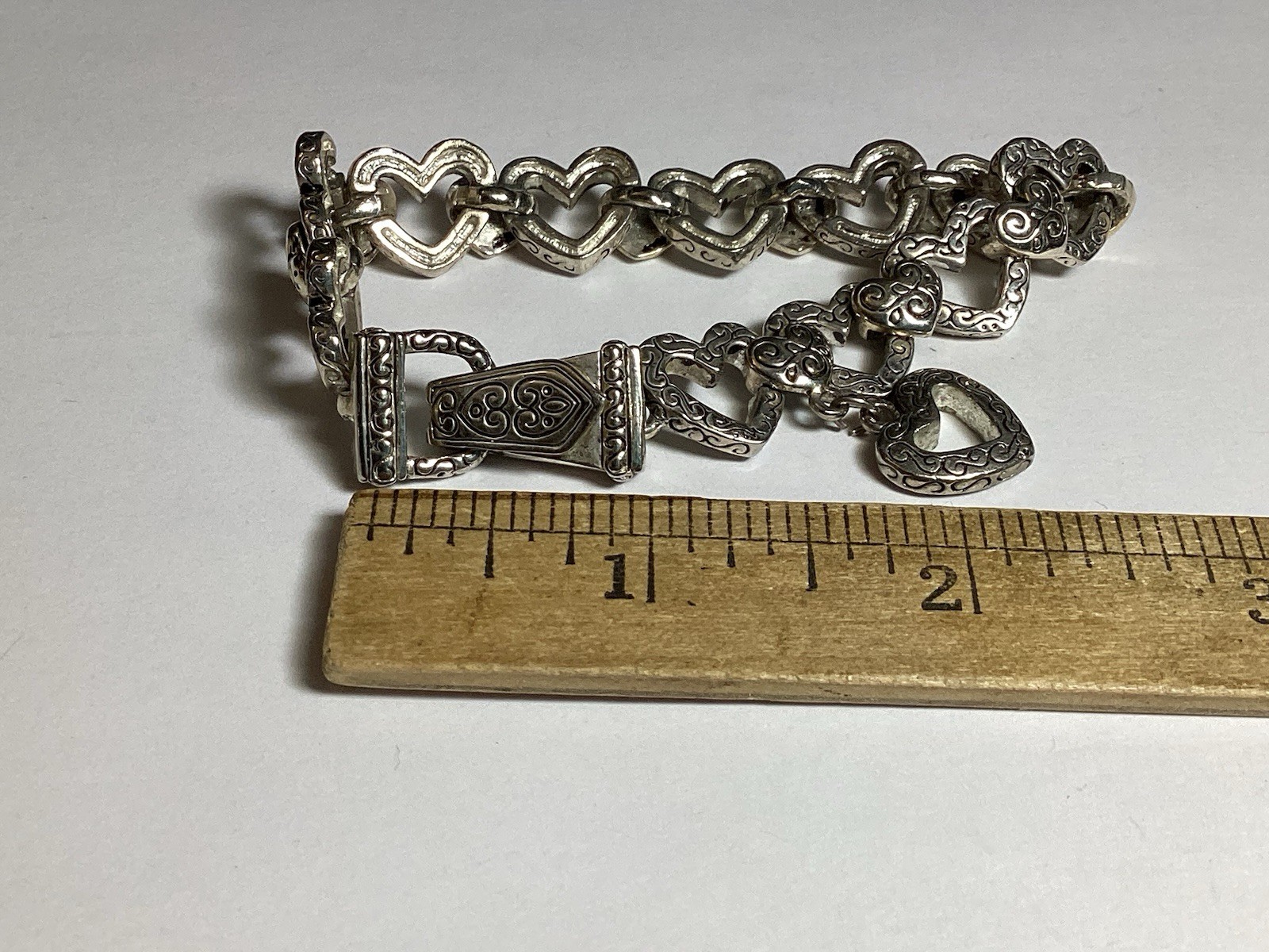 7 3/4” FANCY HEARTS BRACELET WITH DANGLE HEART FOLD OVER MAGNETIC CLASP