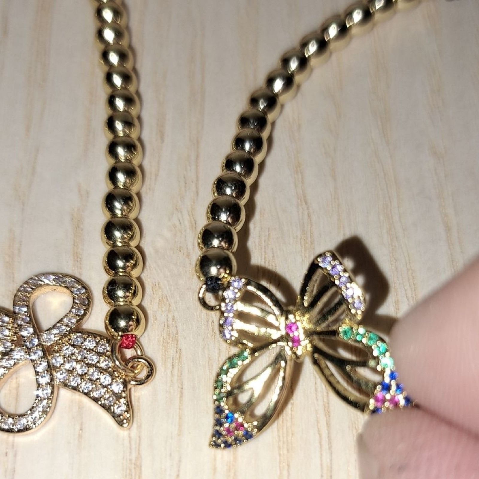 Gold plated Beaded Bracelets with Bow Charms It Fits In A 6″ To 8″ Size