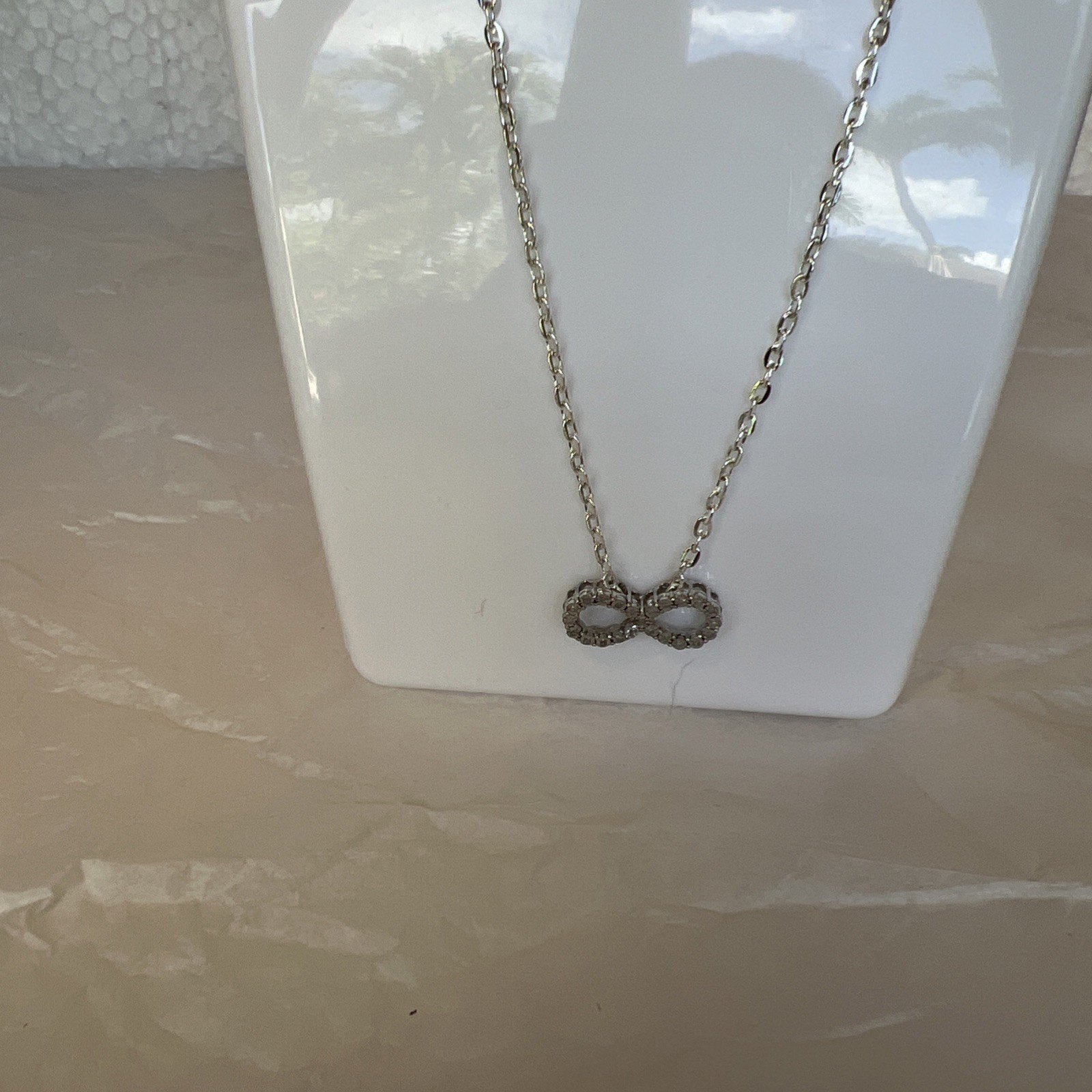 Brilliant Infinity Necklace With silver Chain, new without tags, see photos