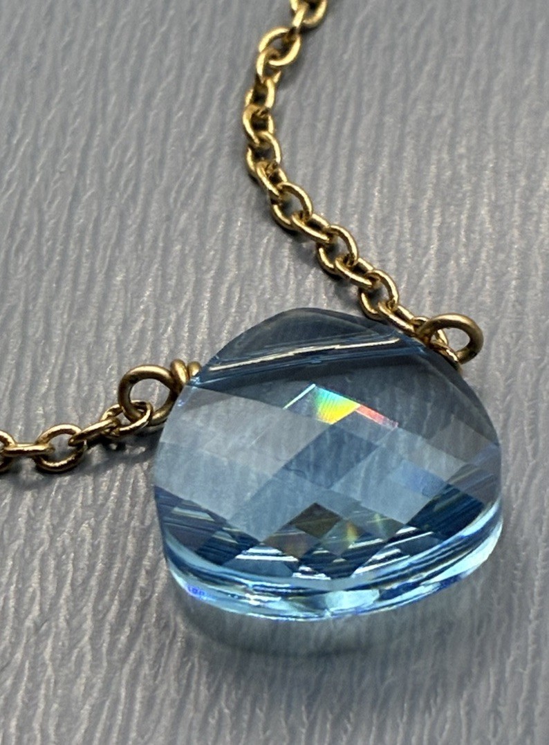 Touchstone Light Sapphire, Briolette, Swarovski Crystal Gold Tone Necklace
