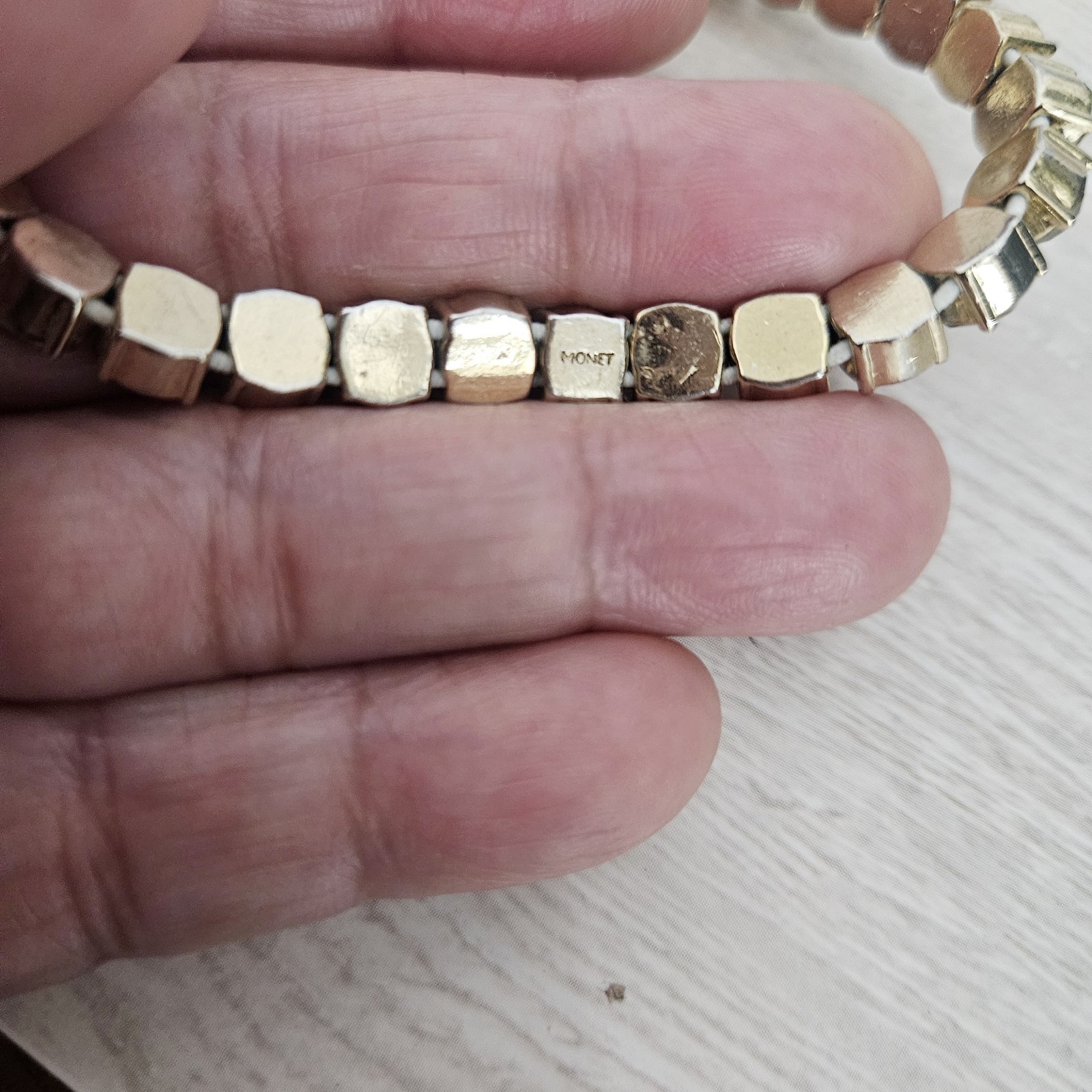 MONET Signed Gold Tone Green Rhinestone Stretch Tennis Bracelet