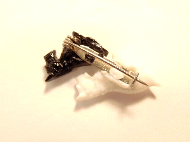 small plastic pin with black & white Terrier type dogs; Made in Great Britain