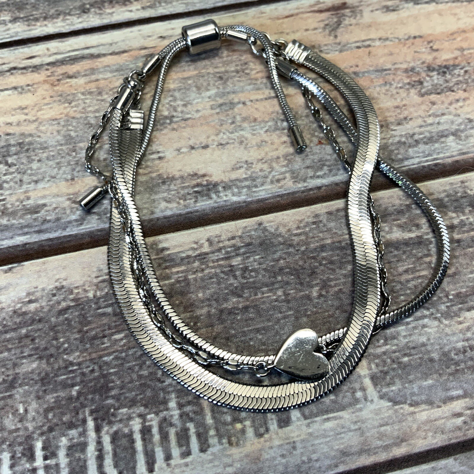 Modern adjustable layered herringbone chain heart bracelet in silver tone