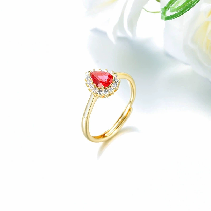 Copper alloy electroplated with 14k gold and inlaid with artificial gemstones