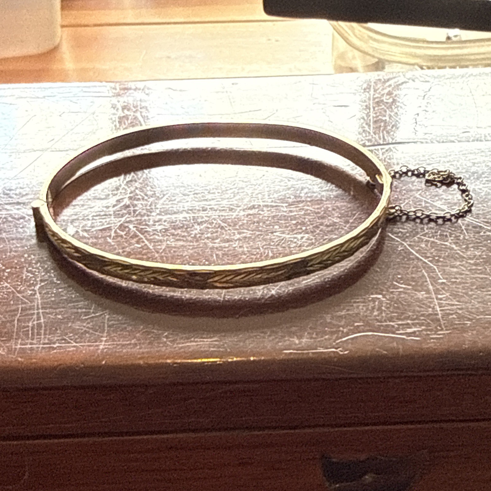 B Ltd 9ct 50 Micron Rolled Gold hinged engraved bangle with safety chain