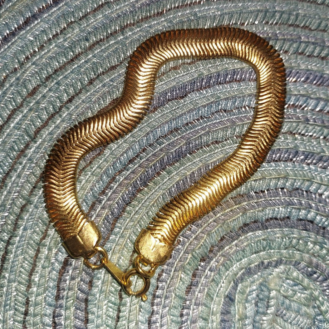gold tone herringbone snake chain bracelet with lobster clasp