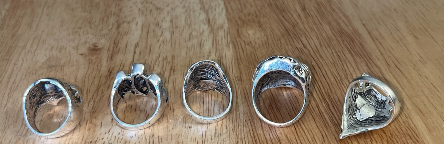 LOT OF 5 MOTORCYCLE BIKER’ S SKULL RINGS…STAINLESS STEEL. VARIOUS SIZES..NEW