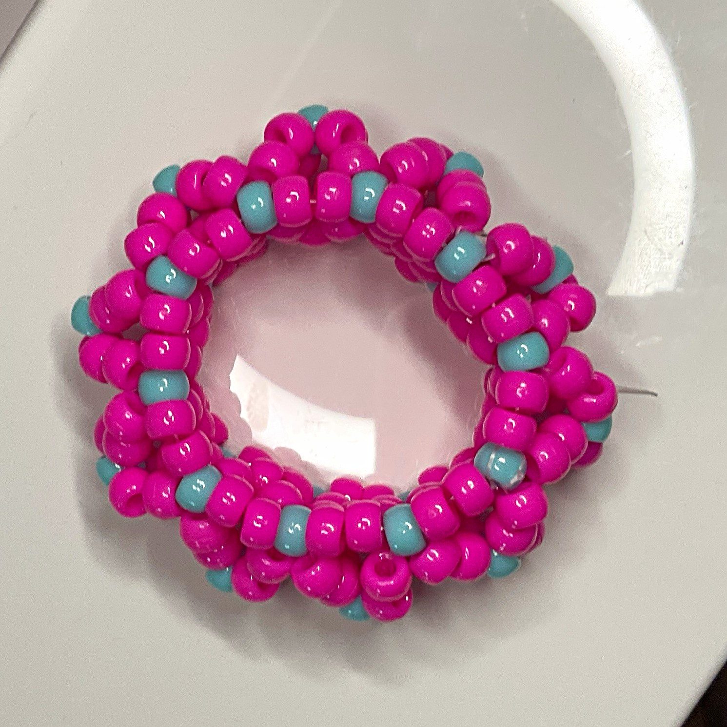 handmade pink w/ cyan accents 3d X’s kandi cuff 😋😋😋 has SUPER stretchy string