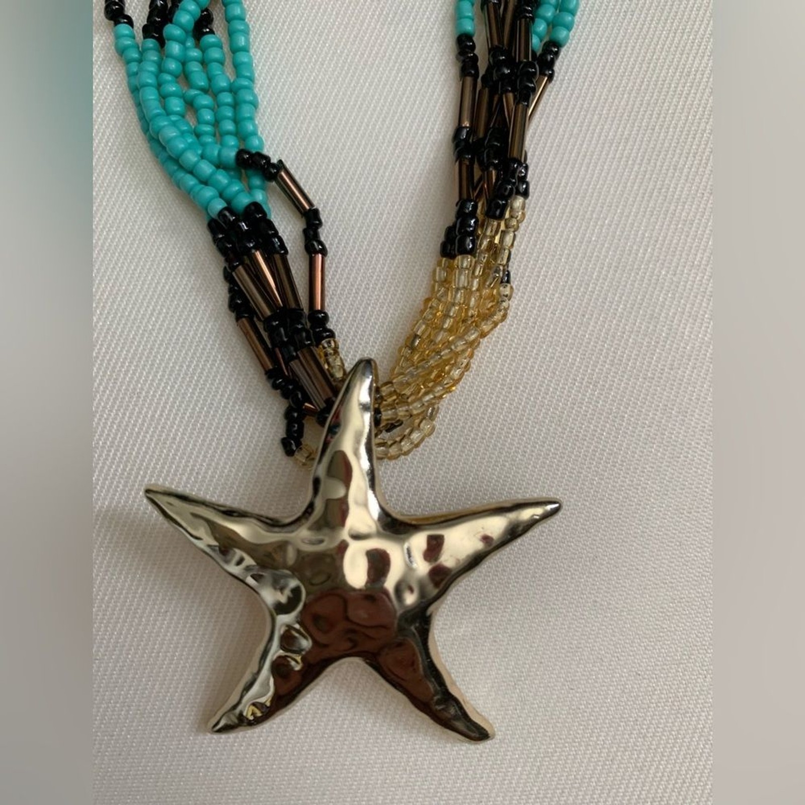 Starfish boho indie beaded summer necklace gold blue black with gold pendant!