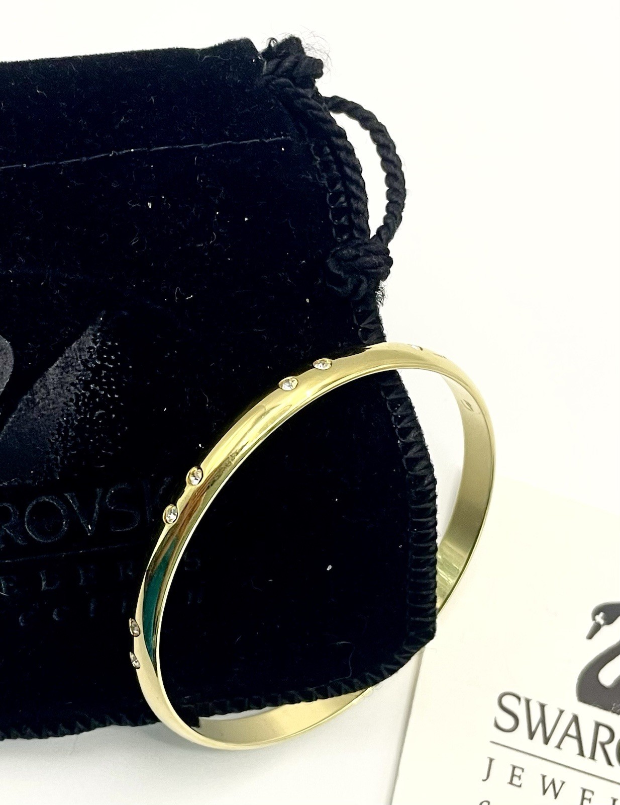 Swarovski Gold Tone Bangle Bracelet with Scattered Crystal Accents Swan Logo