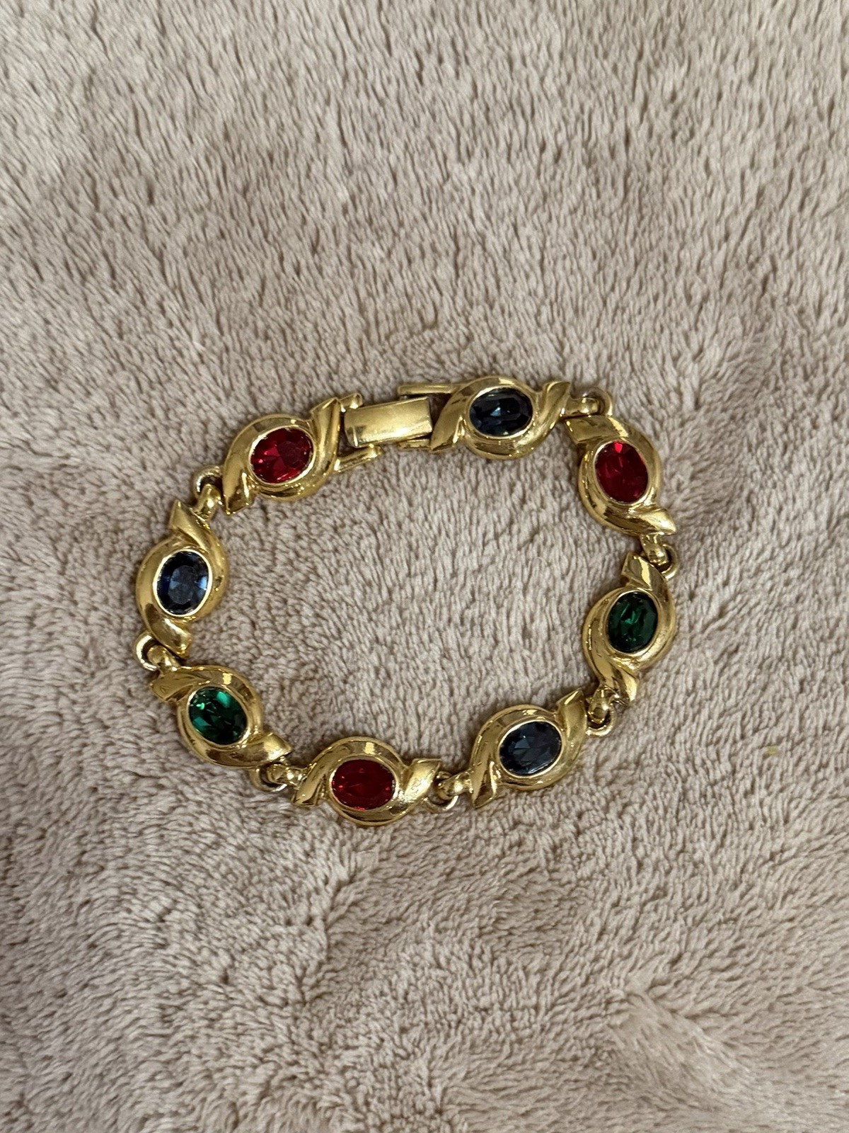 Gold Tone ￼ Costume, jewelry bracelet. With Purple Red And Green Colored Stones