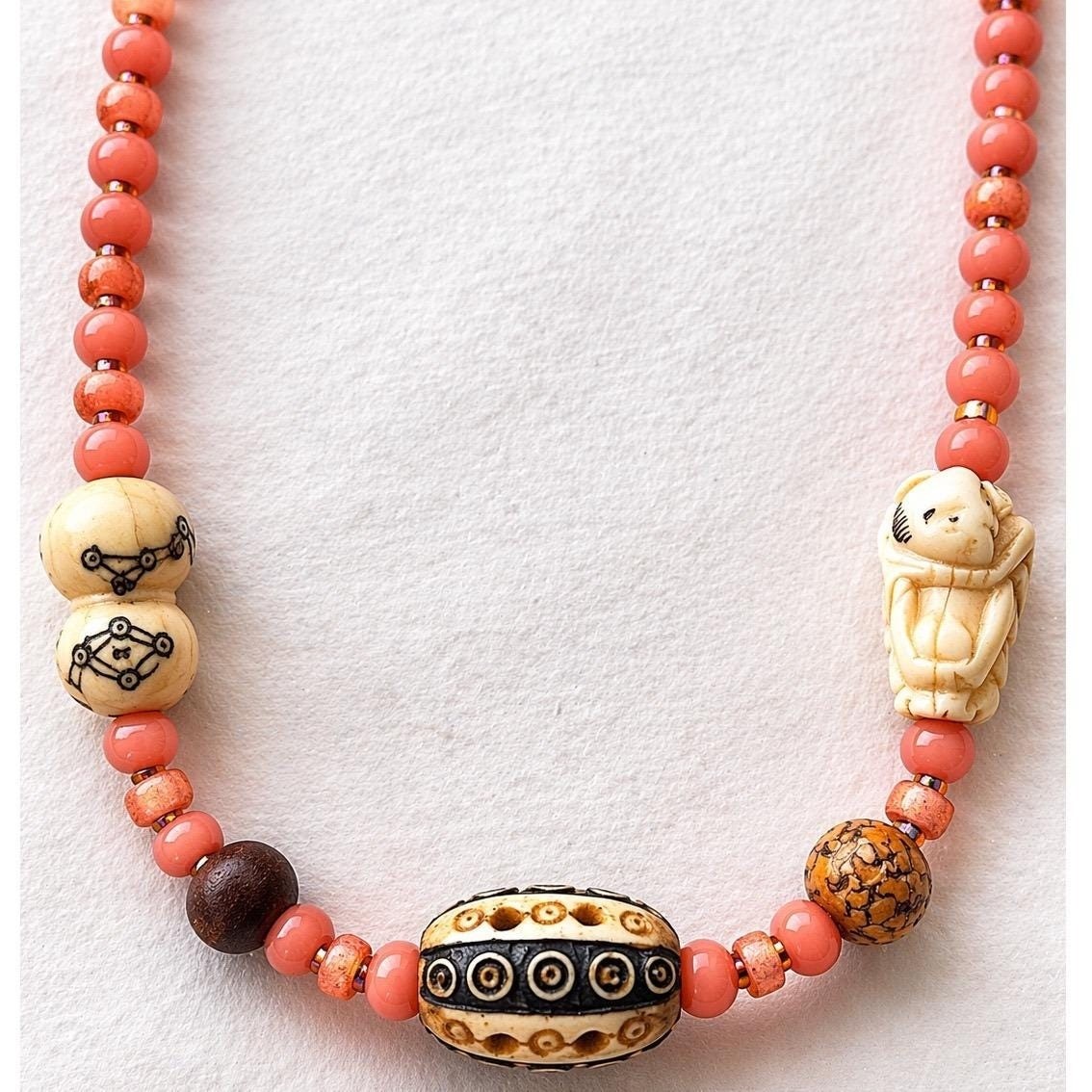 Bohemian Beaded Necklace Salmon Pink Hand Carved Figure Patterned Barrel Bead