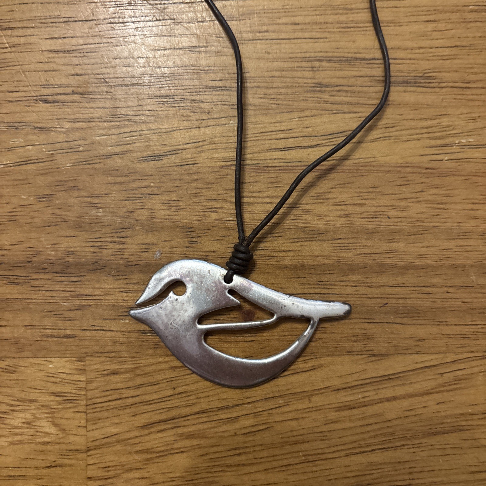 Fossil Silver Bird on brown leather cord – 16” Necklace w/ 2” extender