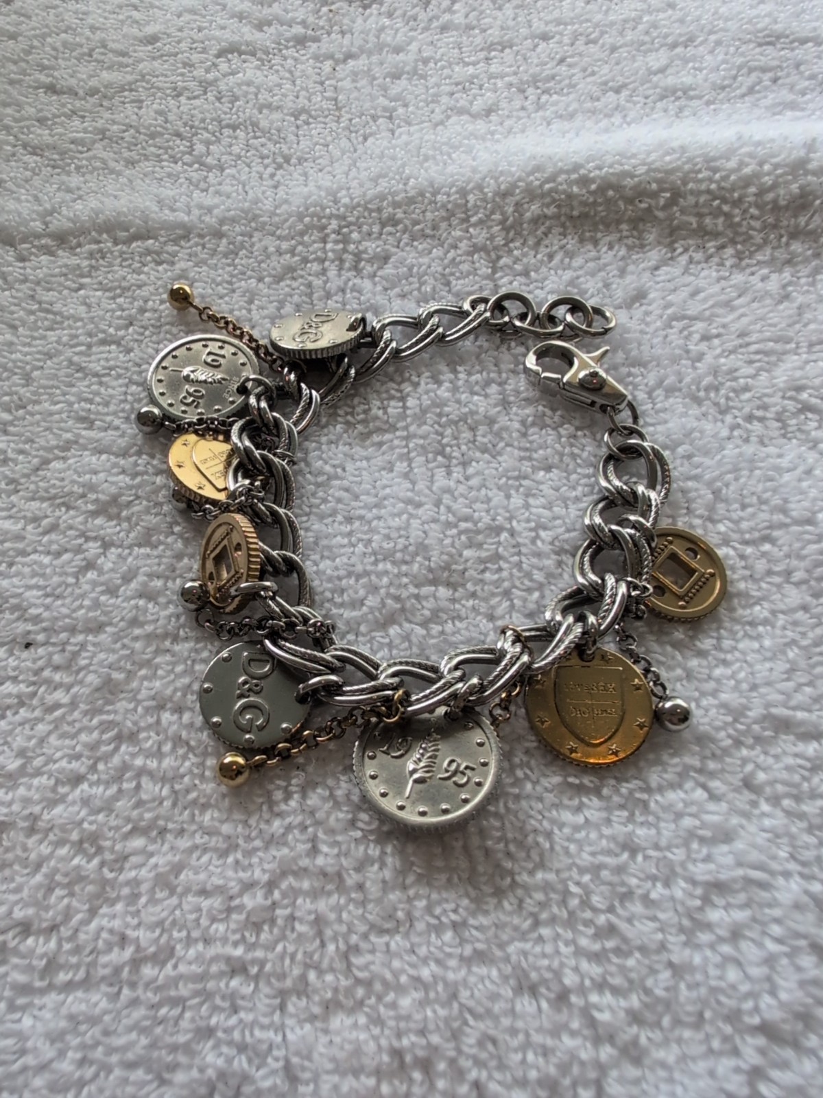 Dolce gabbana bracelet With 15 charms great condition, 8.5″ long Heavy Piece