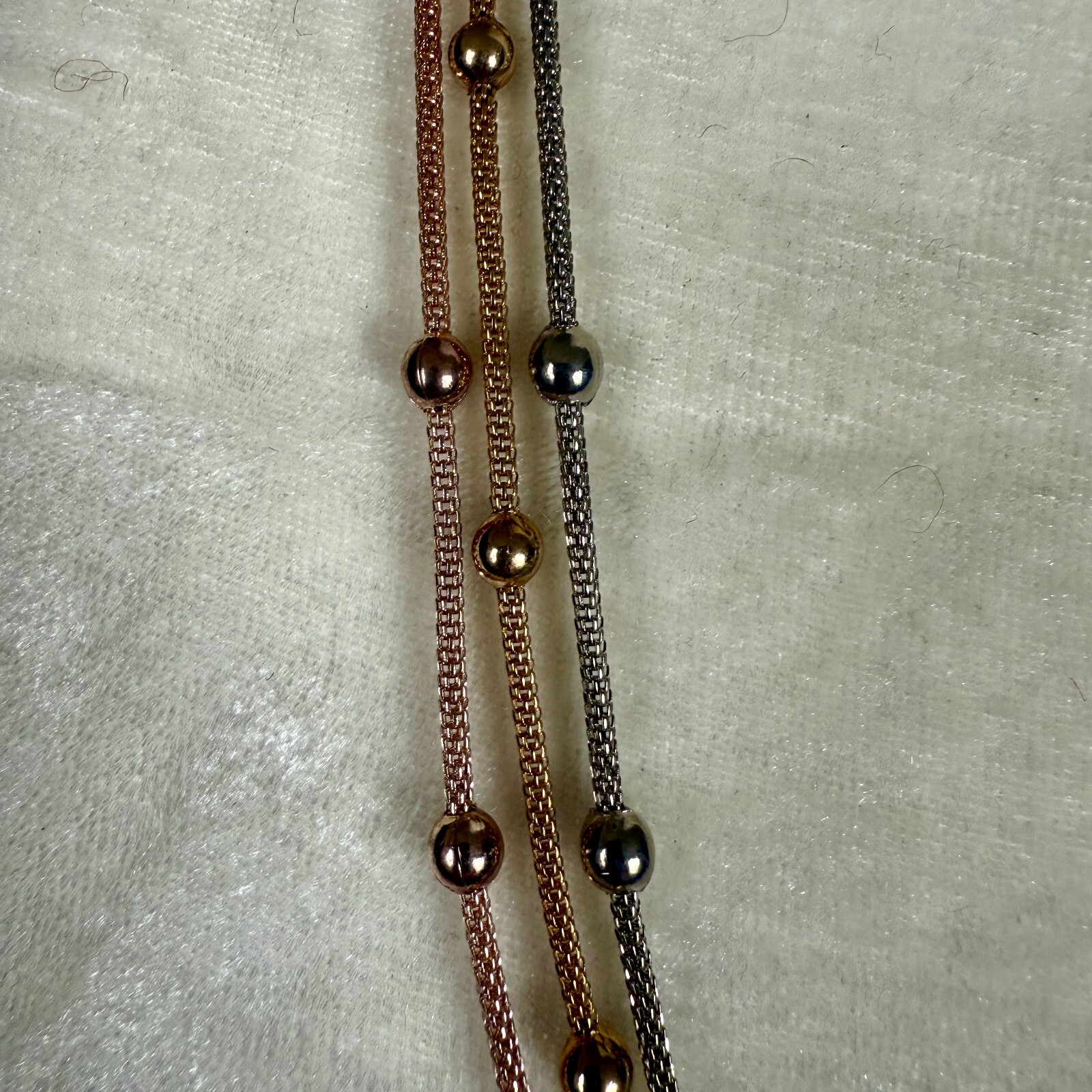Gold and silver rope chain with gold and silver beads and lobster claw closure