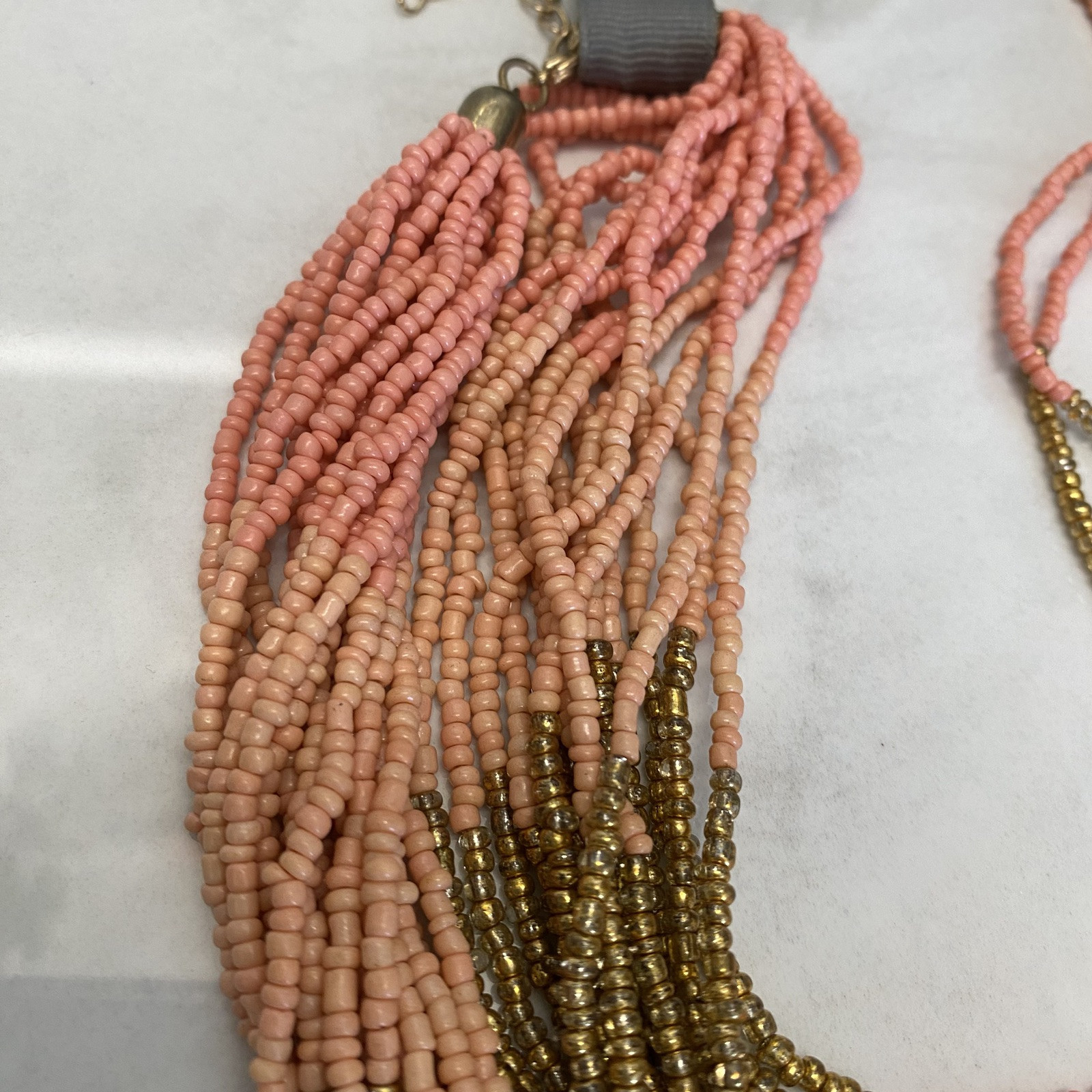New Seed Bead Necklace by Anthropologie salmon pink gold NWT $38. Multi Strand