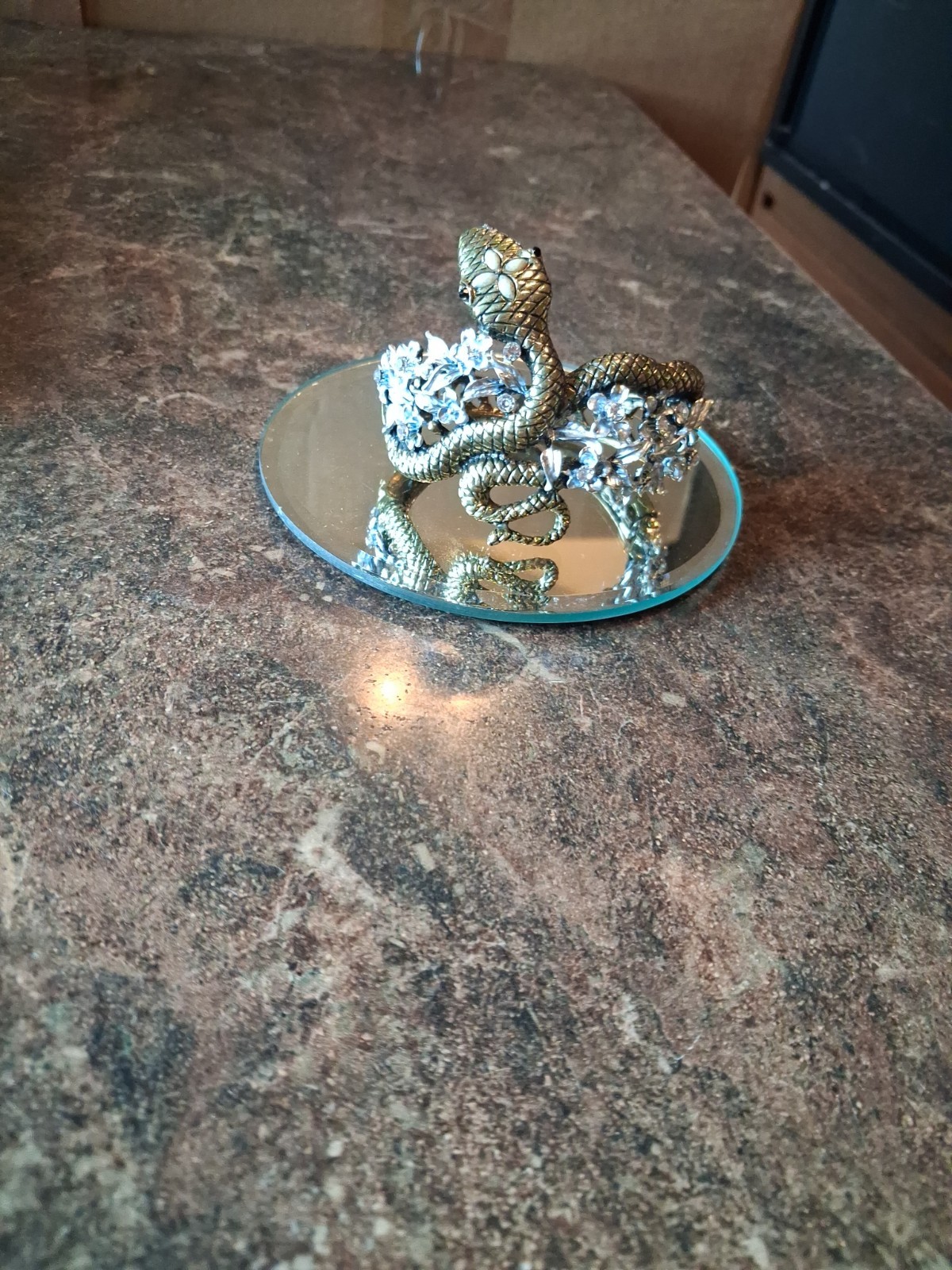 Coiled snake hinge cuffed bracelet