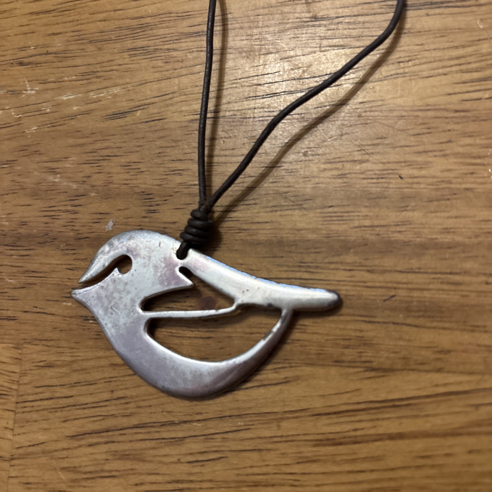 Fossil Silver Bird on brown leather cord – 16” Necklace w/ 2” extender