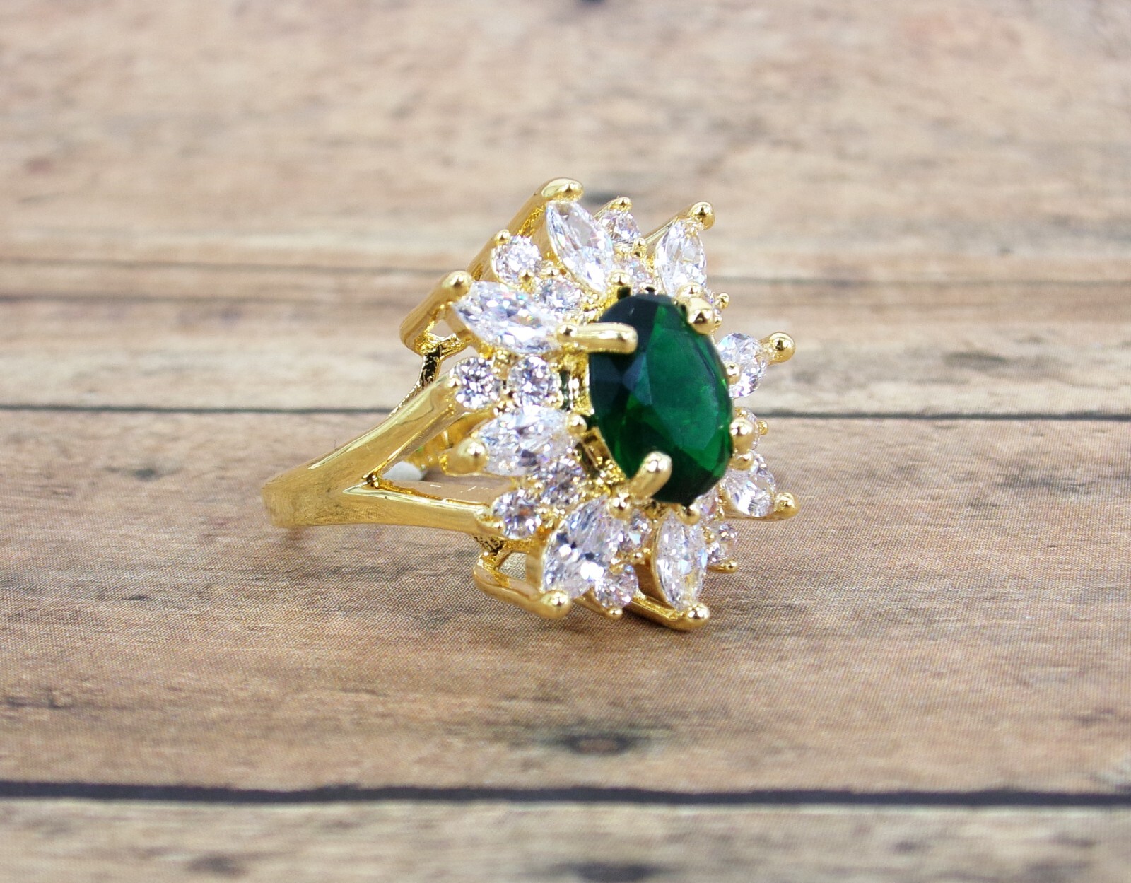 Large green oval cubic zirconia stone ring with clear marquise round CZ stones