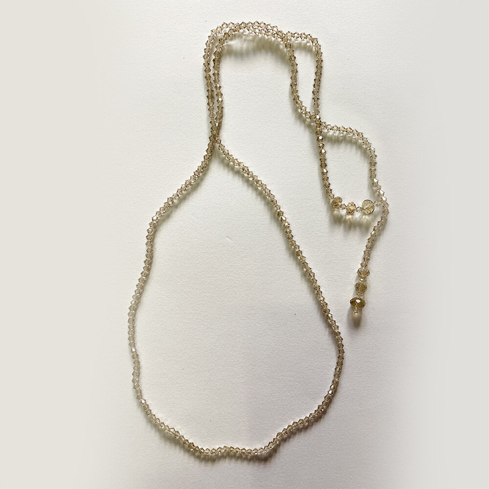 Necklace with Clear White Stones of Various Sizes, Knot Clasp