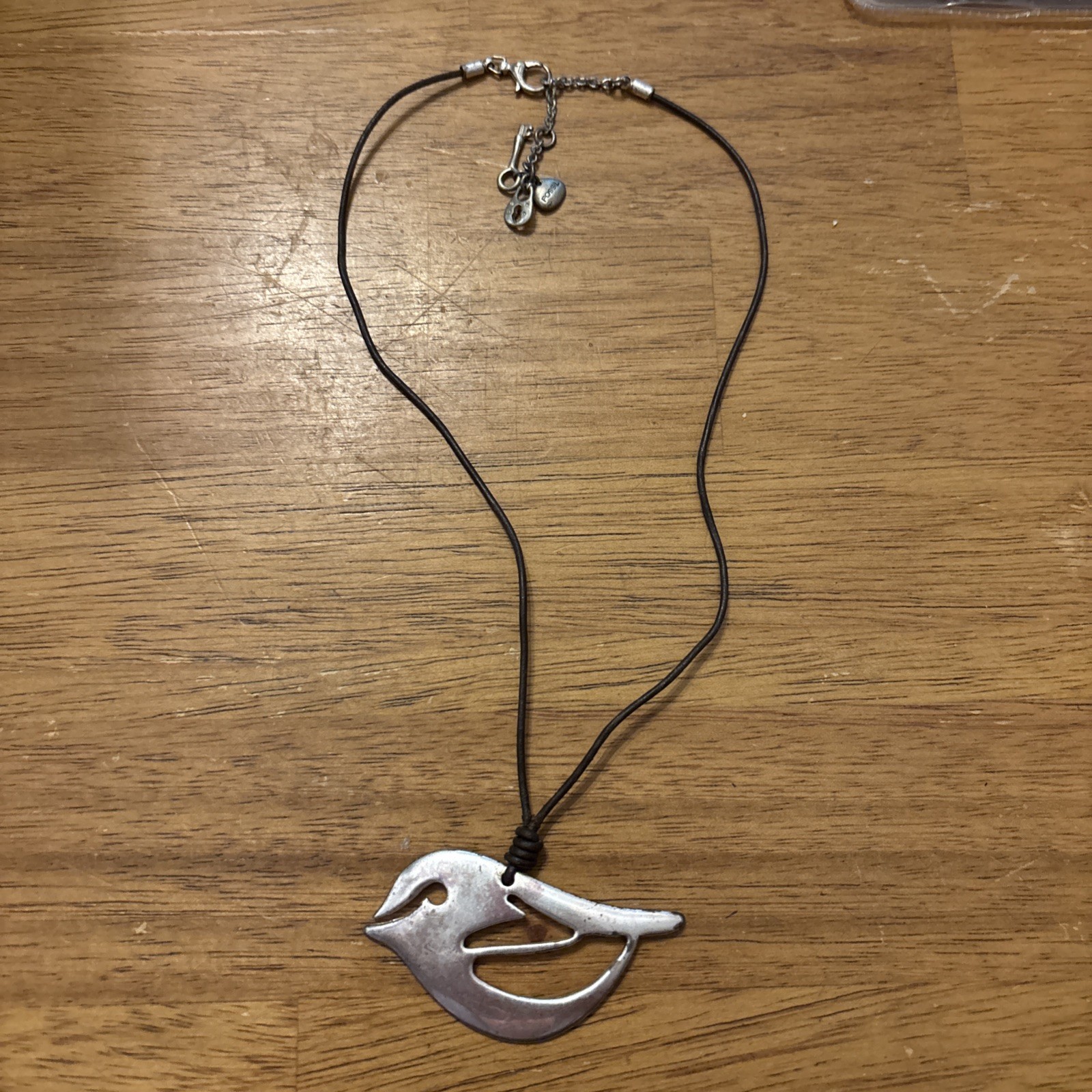 Fossil Silver Bird on brown leather cord – 16” Necklace w/ 2” extender