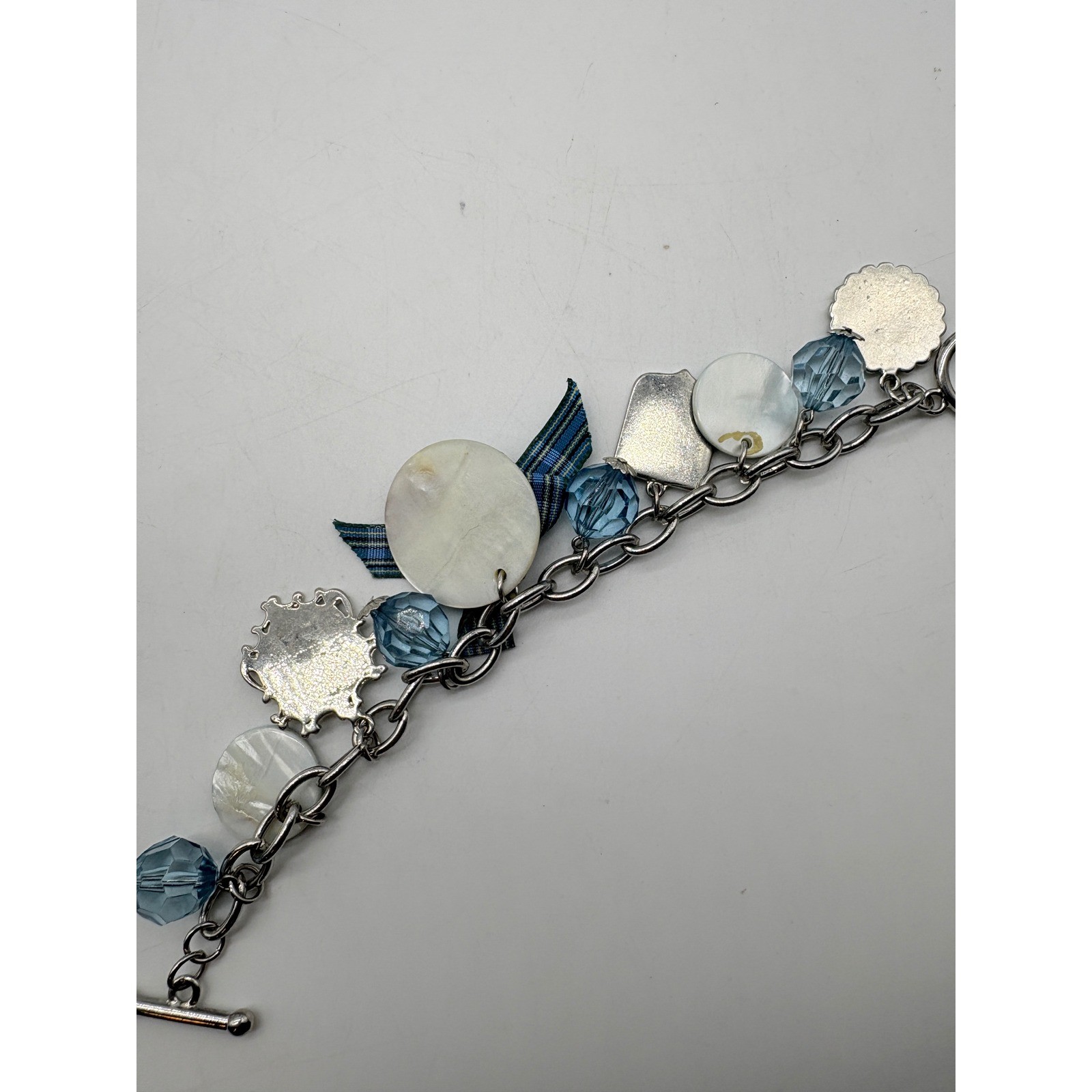 Blue Plaid Fleur De Lis Charm Bracelet Silver Tone Toggle Clasp Glass Bead Bow