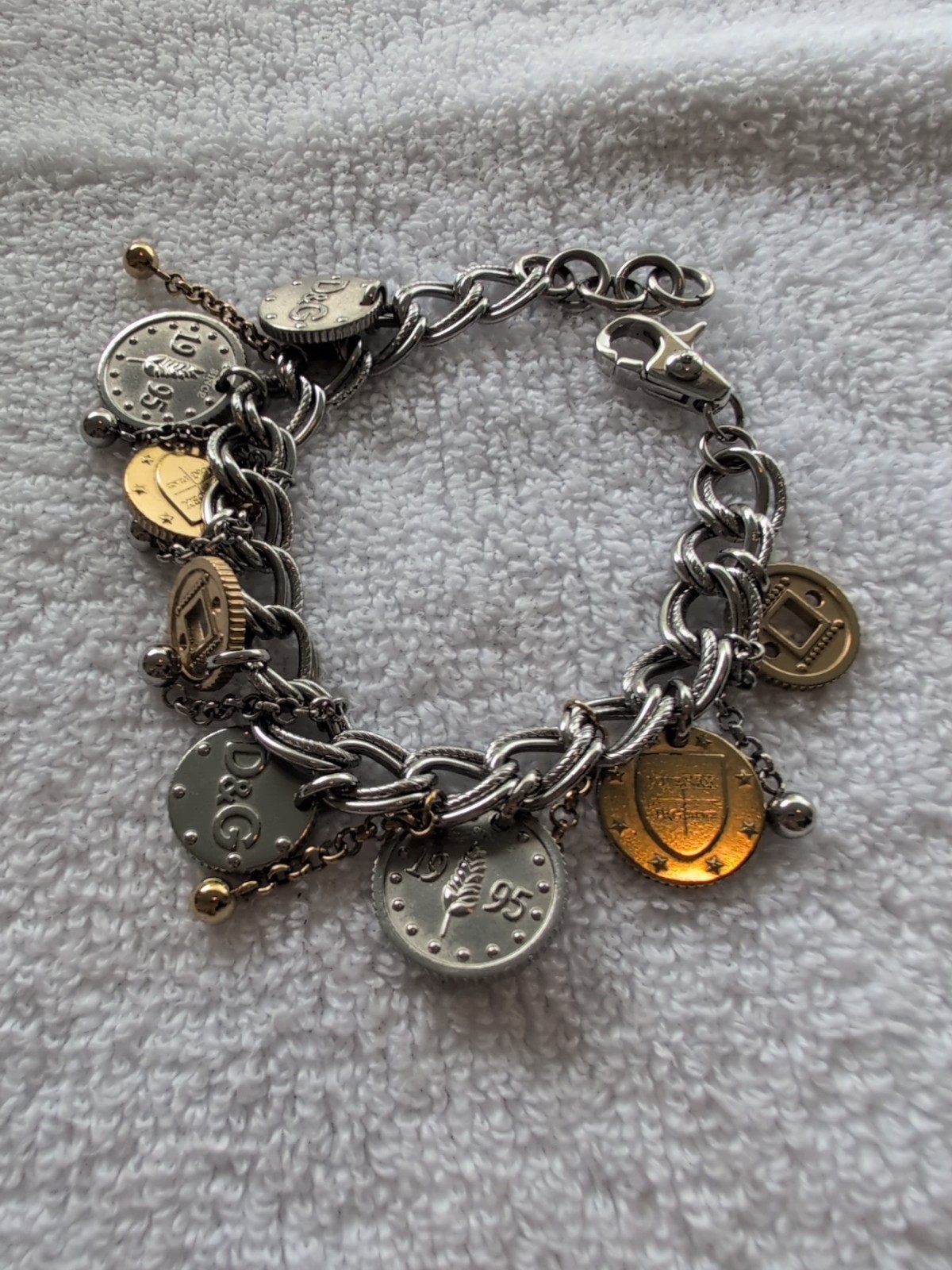Dolce gabbana bracelet With 15 charms great condition, 8.5″ long Heavy Piece