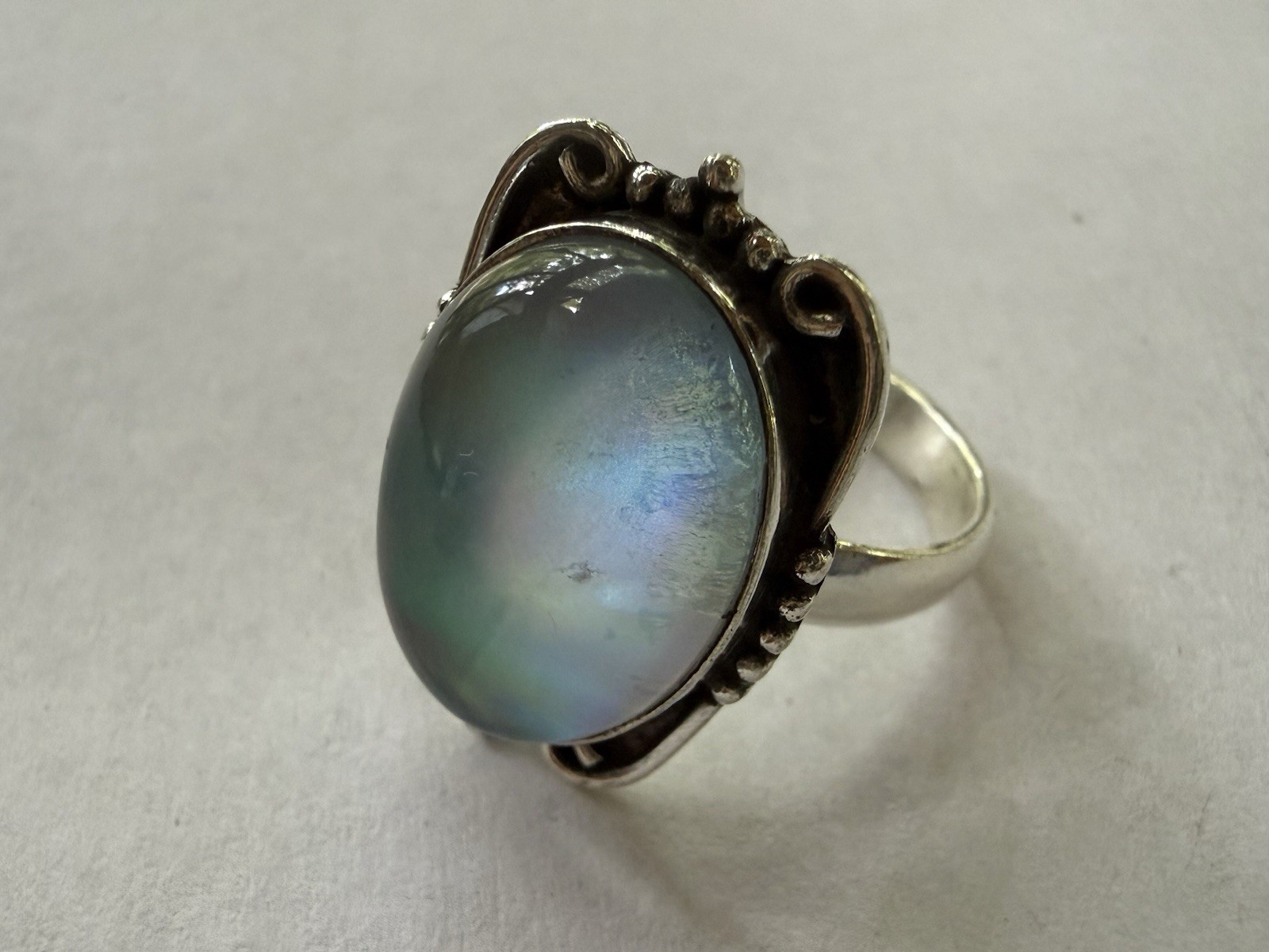 Elegant size 10 silver plated statement ring featuring an iridescent Opalite.