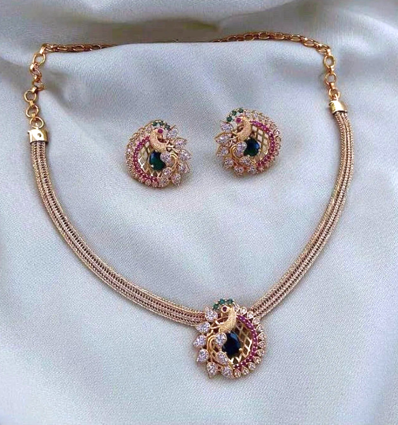 Temple Gold Choker Set features a vibrant peacock necklace