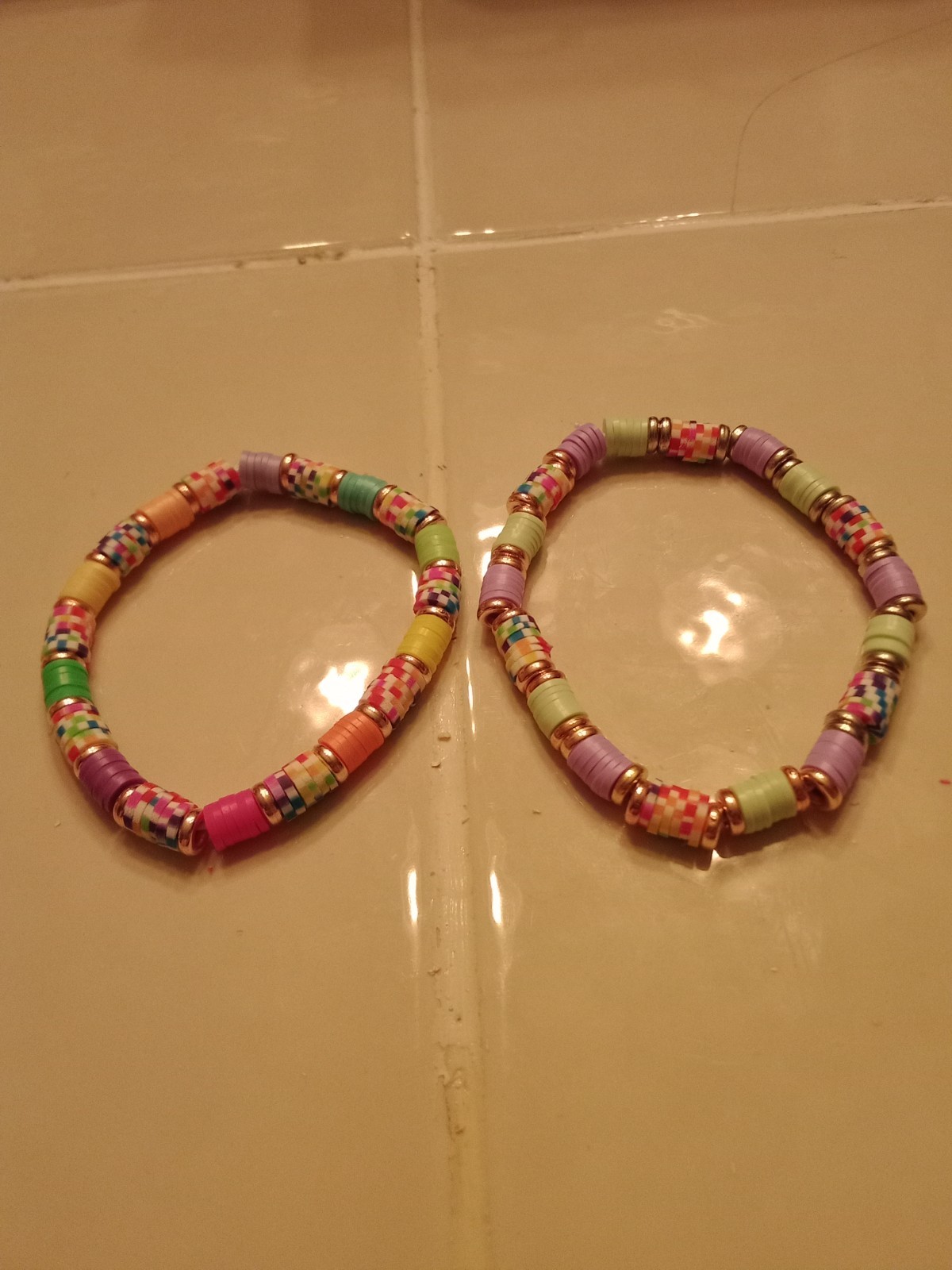 multi colored heishi beads bracelets with silver spacers