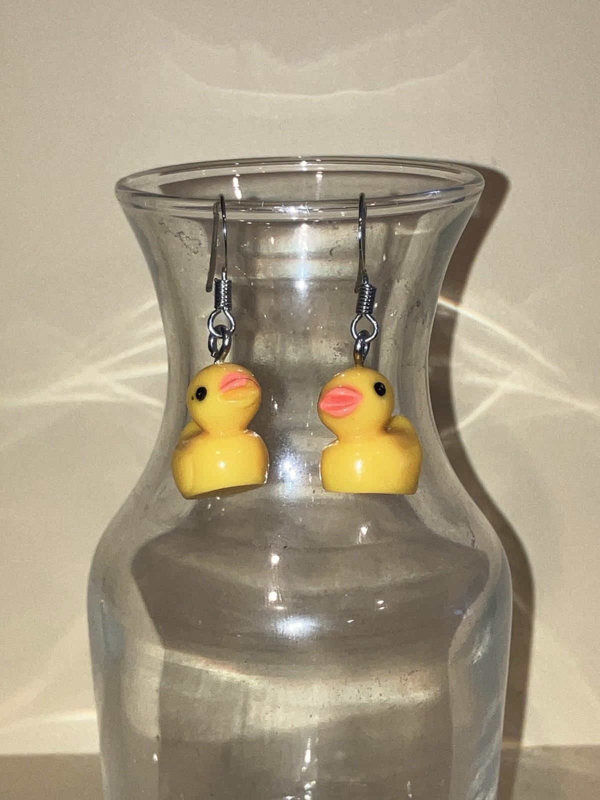 Dangle ducky charm earrings