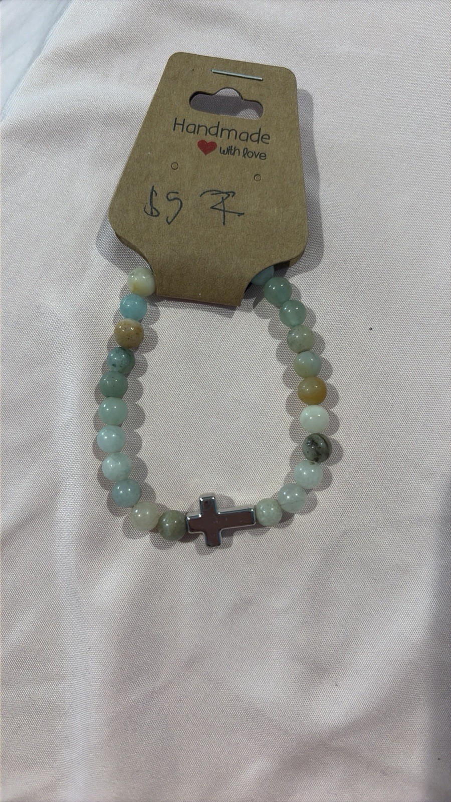 Earthy Metal Cross Toned Bracelet With Blue And Green Undertones
