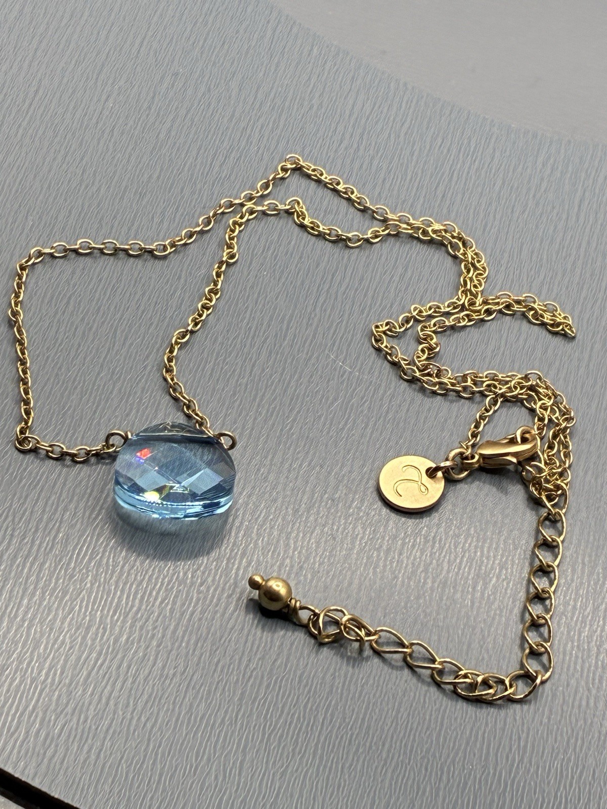 Touchstone Light Sapphire, Briolette, Swarovski Crystal Gold Tone Necklace