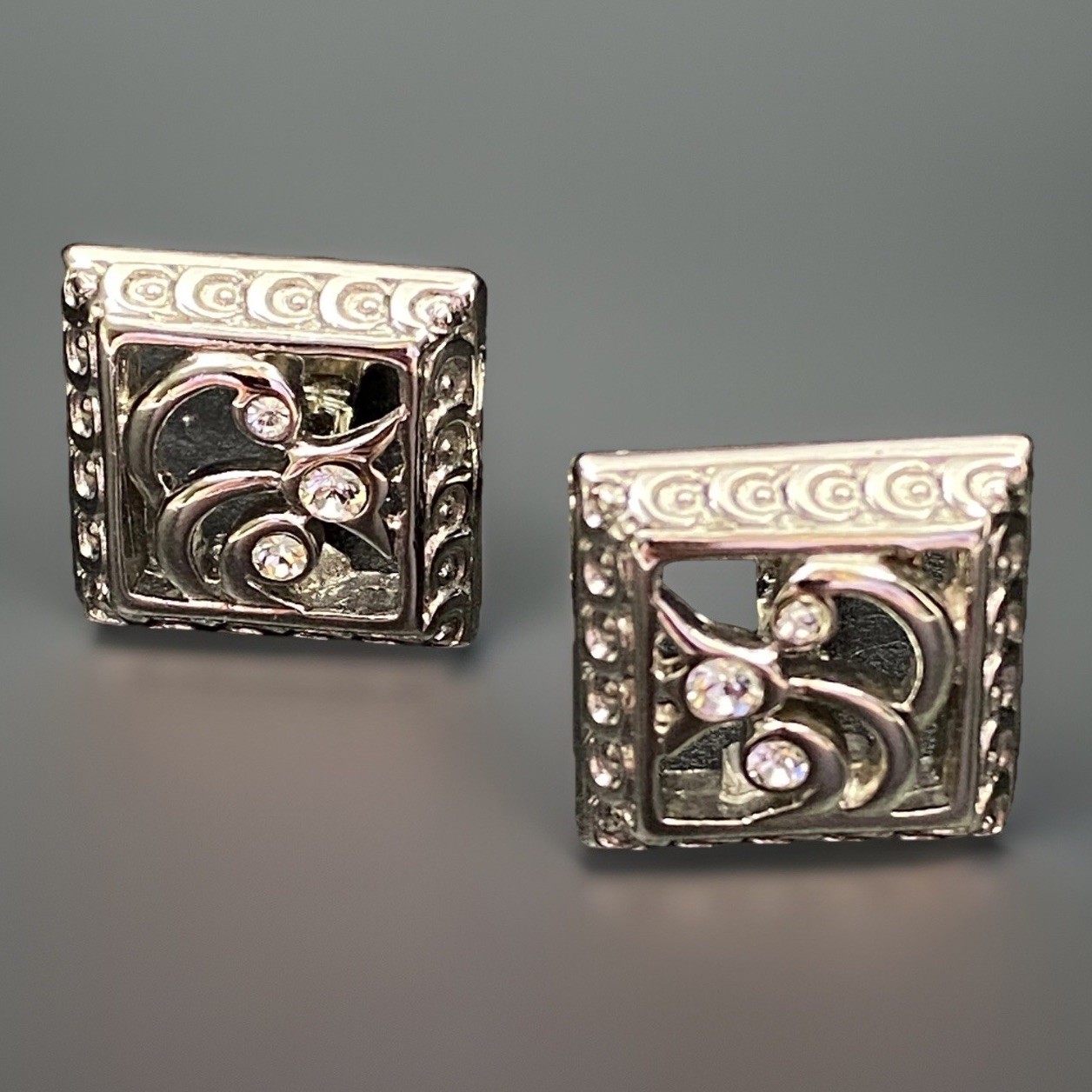 Avon Clip On Earrings Ornate Silvertone Rhinestones Scroll .75″ x .75″