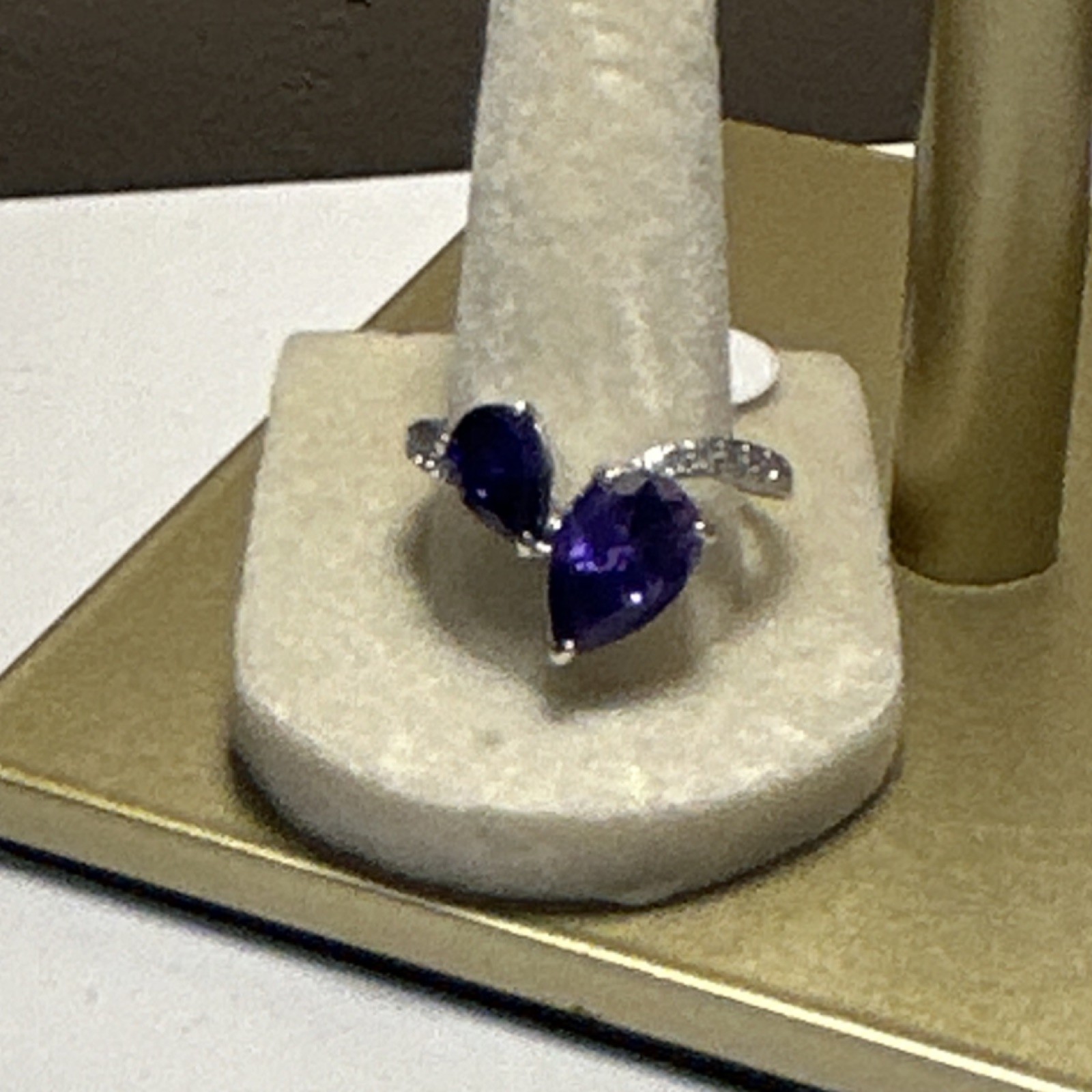Rhodium plated two pear-shaped lab created purple amethyst stones, prong set