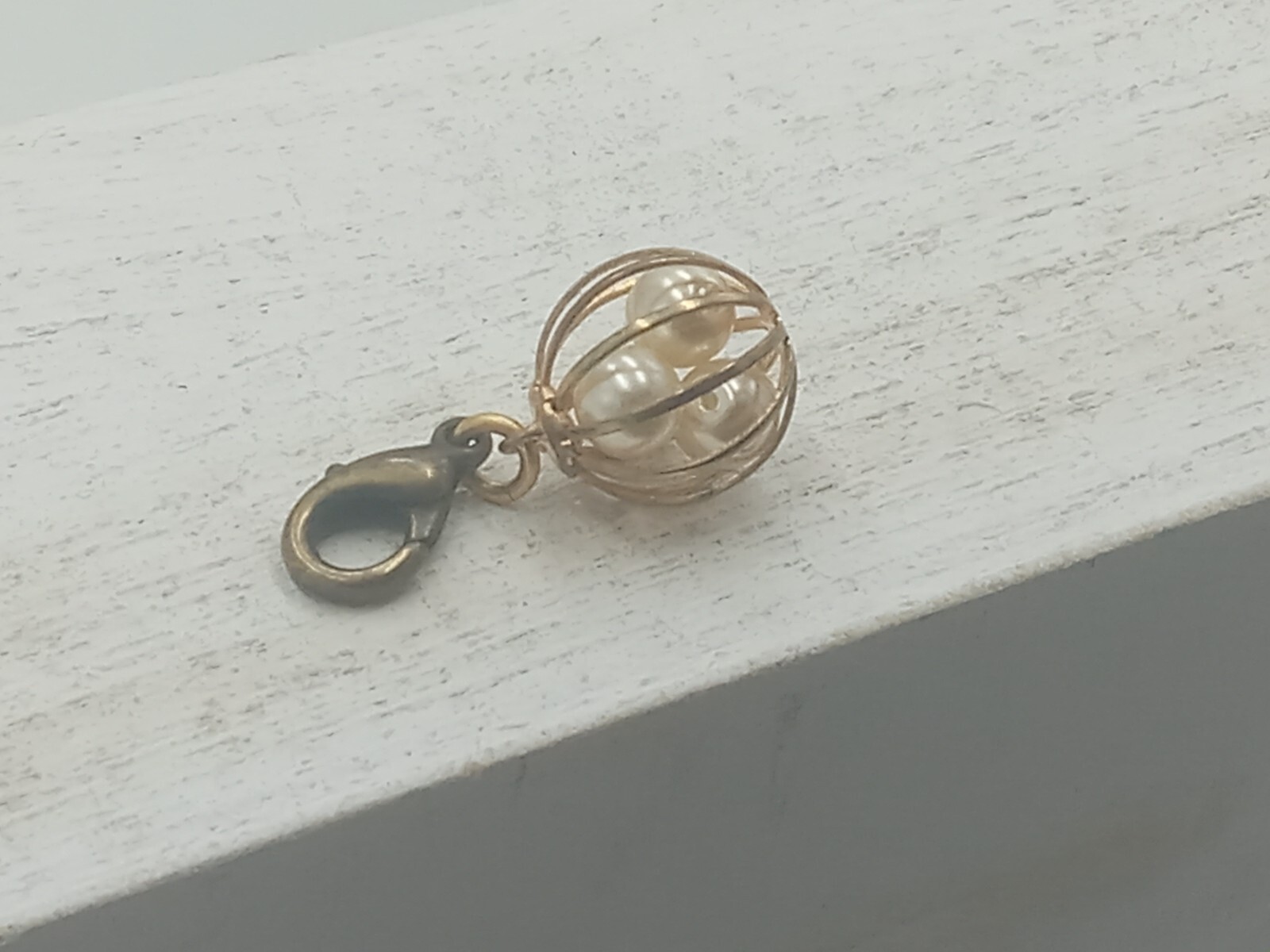 John Wind Caged Pearl Charm with Lobstaer Claw Brass ans Pearl