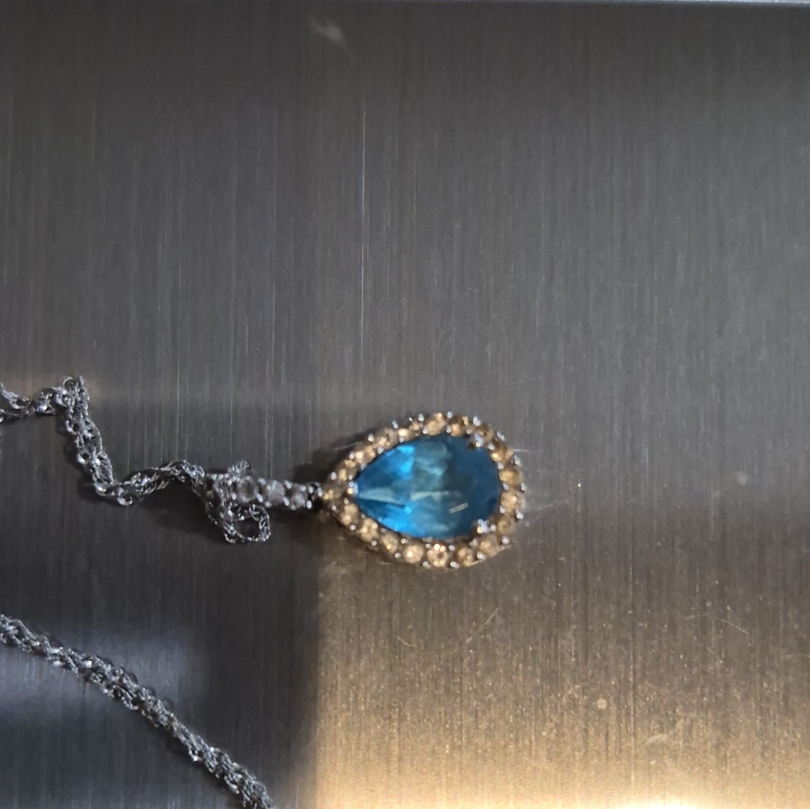 14kt white gold blue topaz and diamond accented necklace 18 inch chain