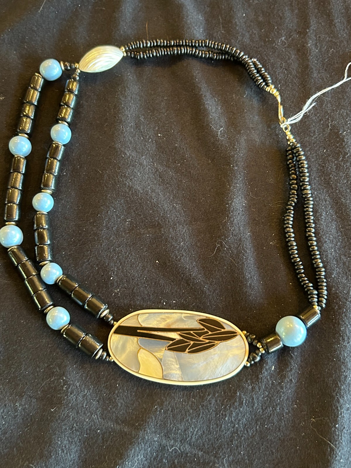21″ necklace with mulitiple beads with Mother of Pearl! One of a kind!