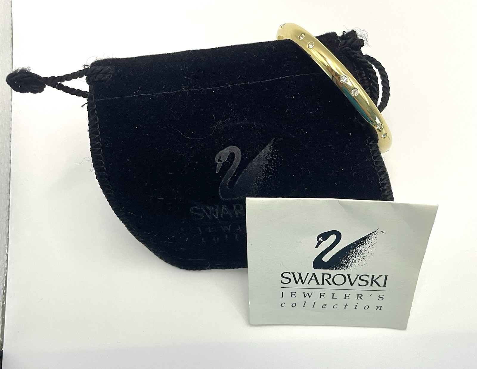 Swarovski Gold Tone Bangle Bracelet with Scattered Crystal Accents Swan Logo