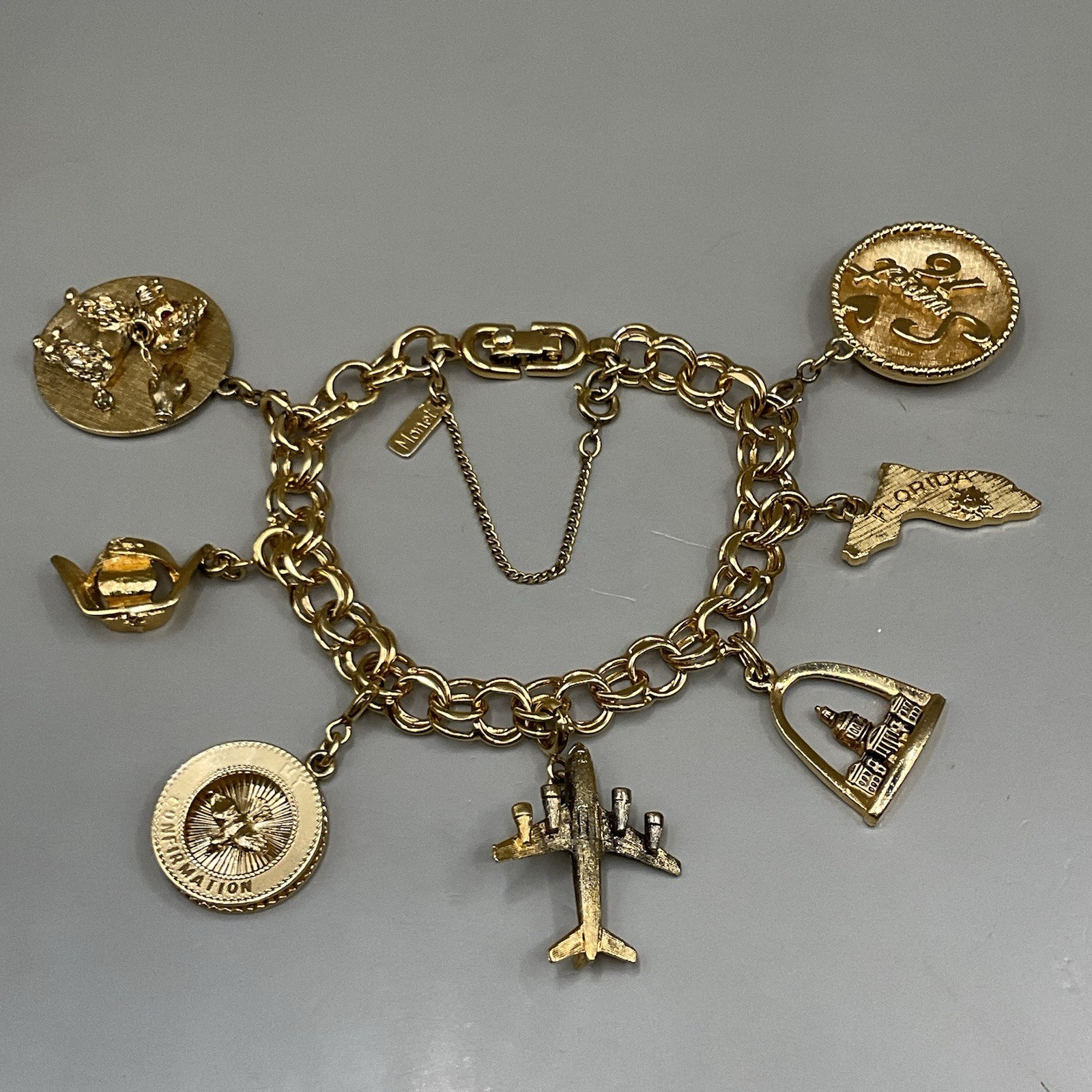Monet Women’s 7 Charm Bracelet Gold Tone Travel Birthday Puppy Travel Communion
