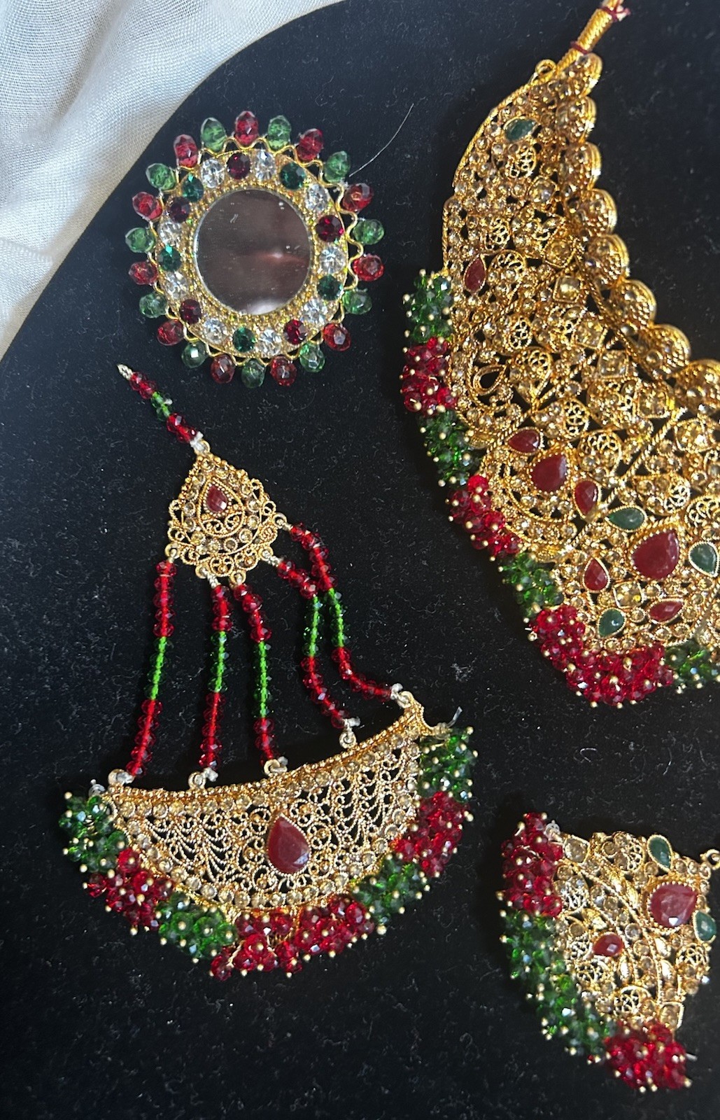 Gold Jewelry Set with Red and Green Details