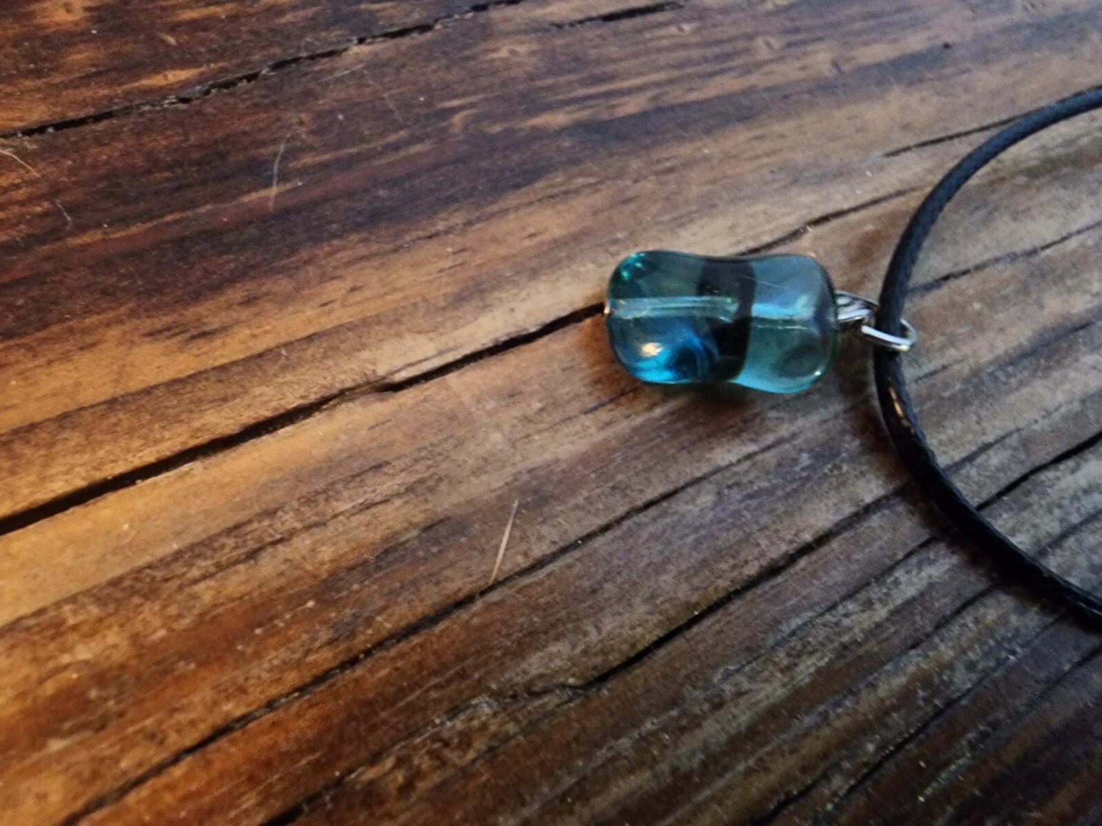 Handmade Black Corded Necklace with Clear Blue Glass Bead and black stripe